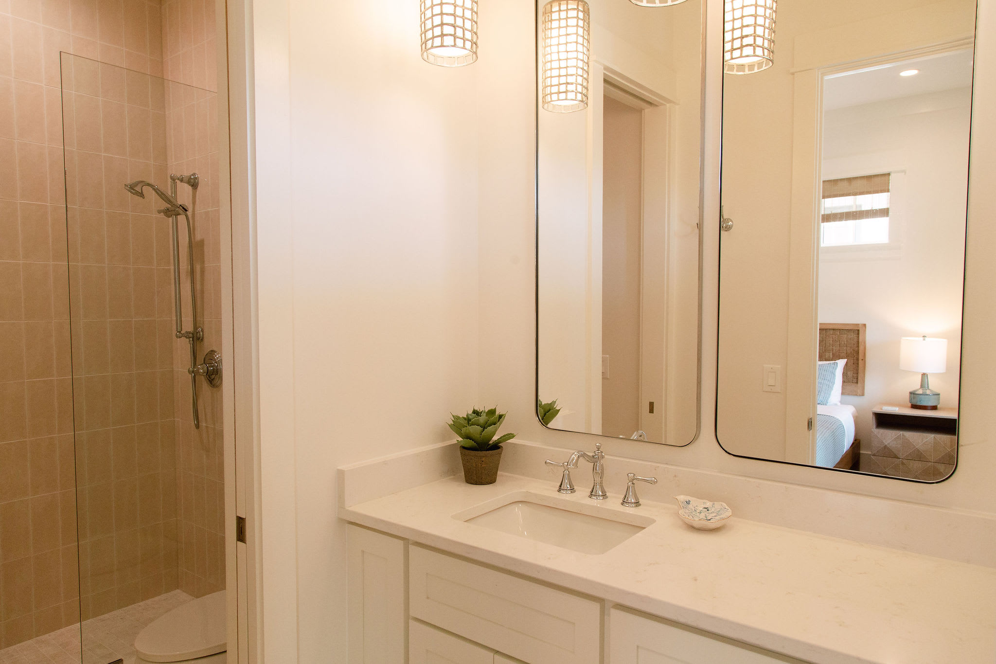 On-suite bath for family bedroom features private water closet and shower.