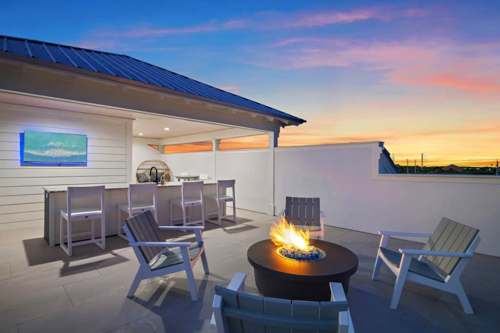 Stunning Gulf views from the rooftop while you relax by the firepit.