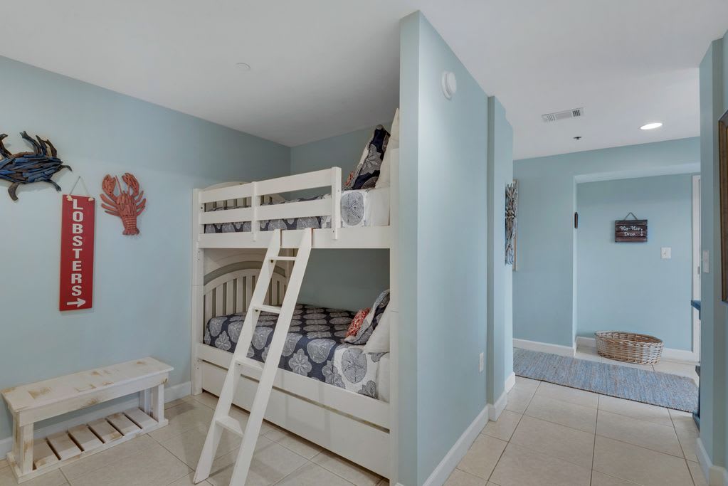 The bunk nook is away from the main living area. Below is also a trundle bed.