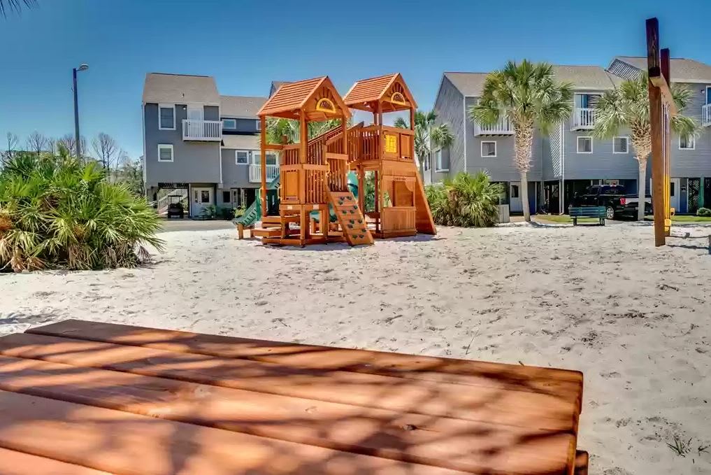 Playground w/ picnic tables and benches just steps from the house 
