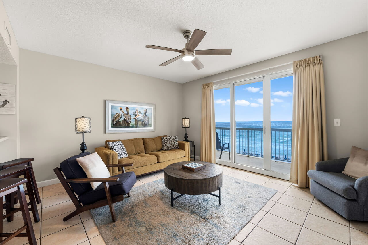Beachfront living room with ocean-view balcony and coastal furnishings