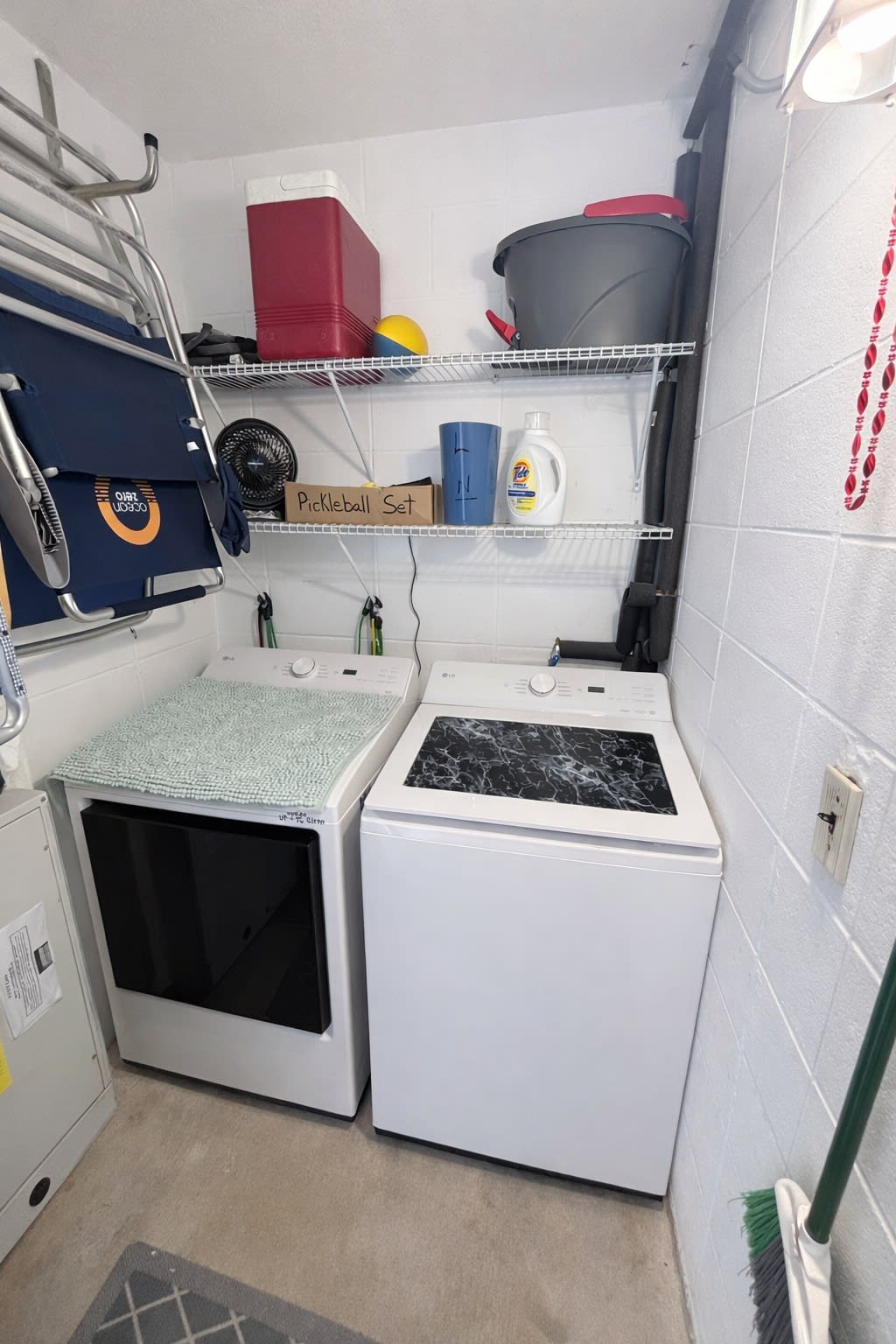 Utility room with new LG washer and dryer. 