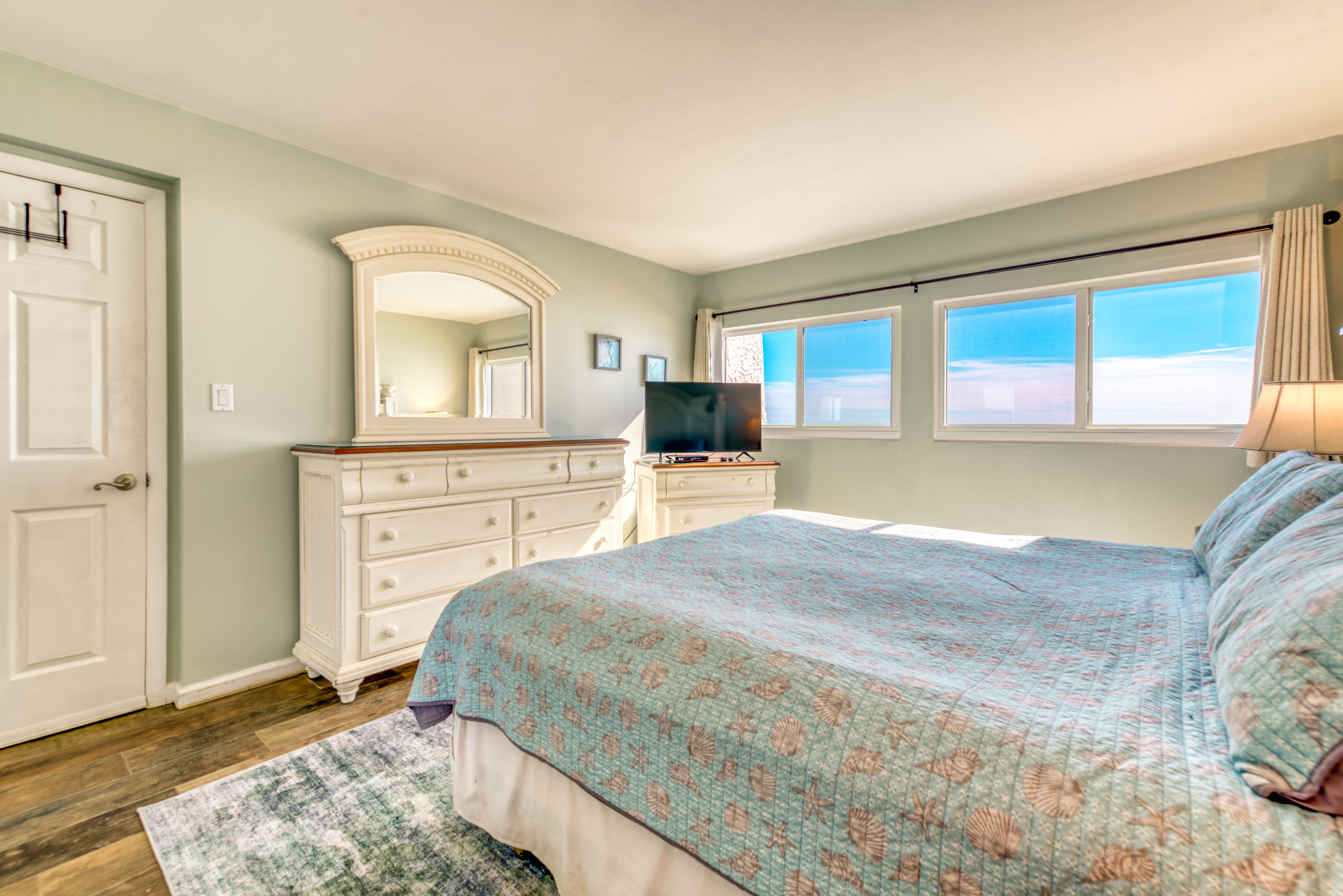 Unwind in this cozy king bedroom with a TV for your entertainment.