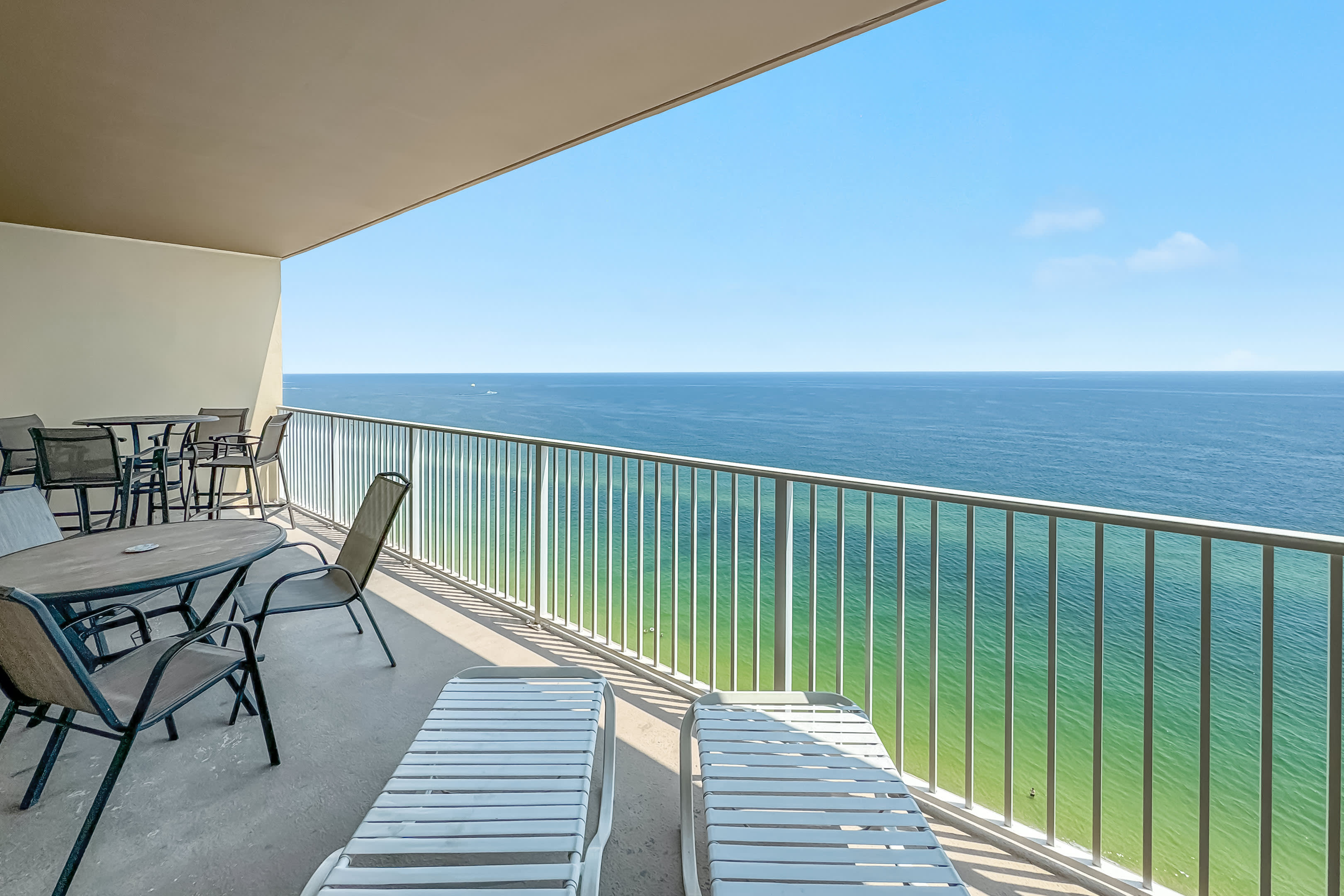 My large balcony w a balcony height table and a reg. height table w 2 loungers