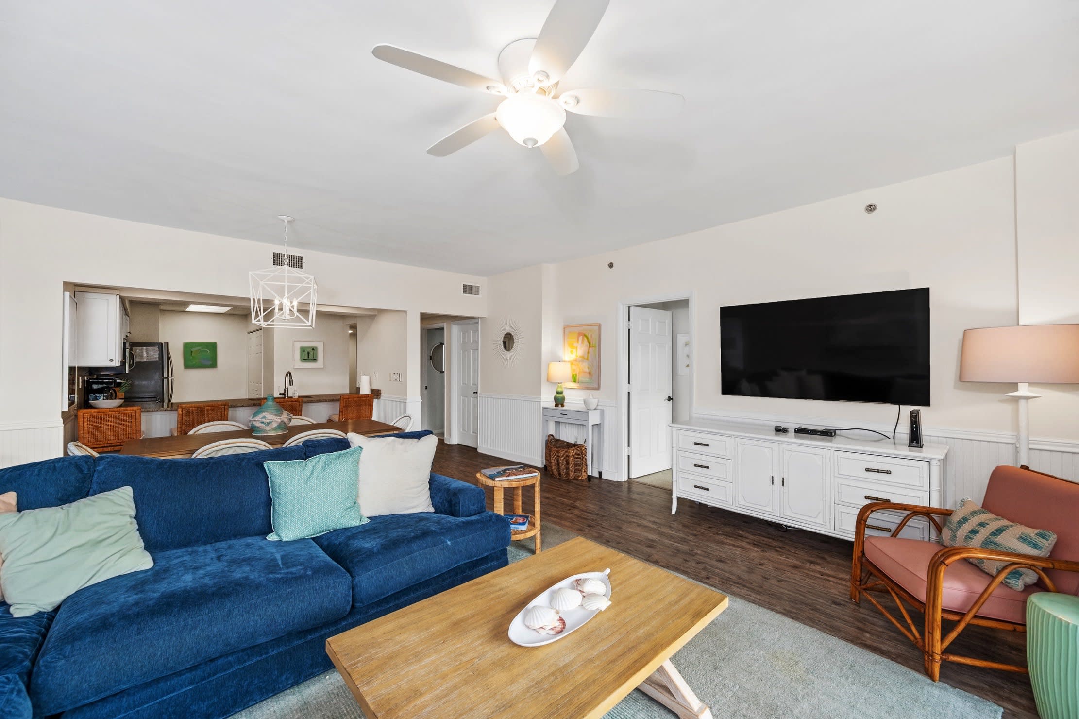 Spacious living area with comfortable seating and large screen tv.