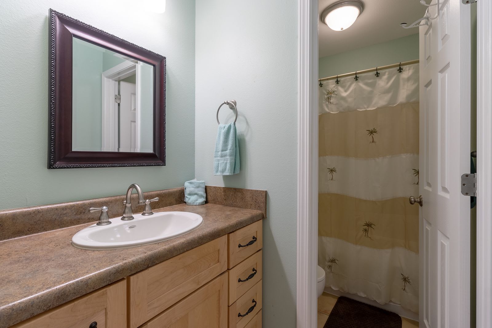 Master bath has second door for privacy  with toilet full size tub and shower