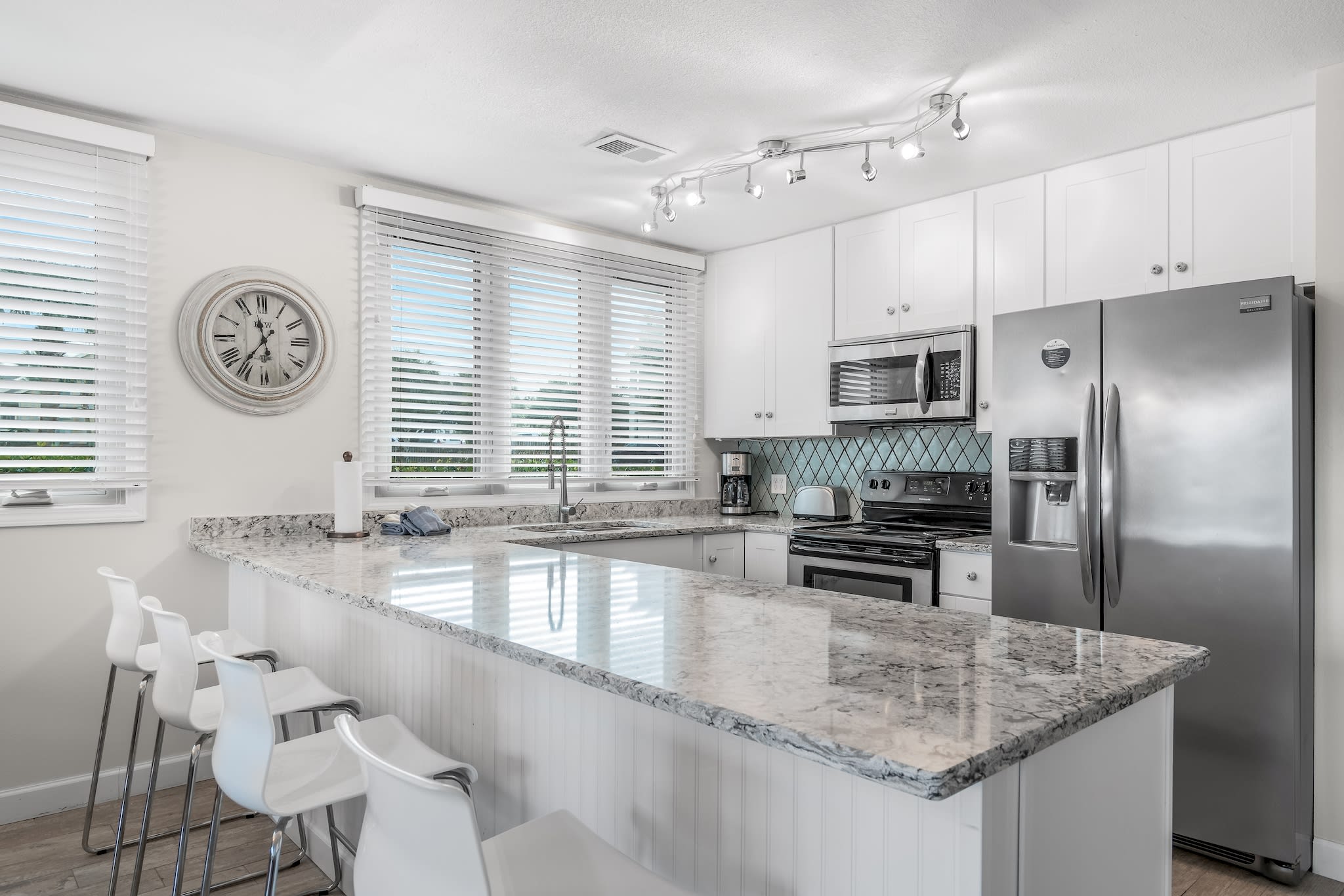 Huge, open kitchen has dining bar