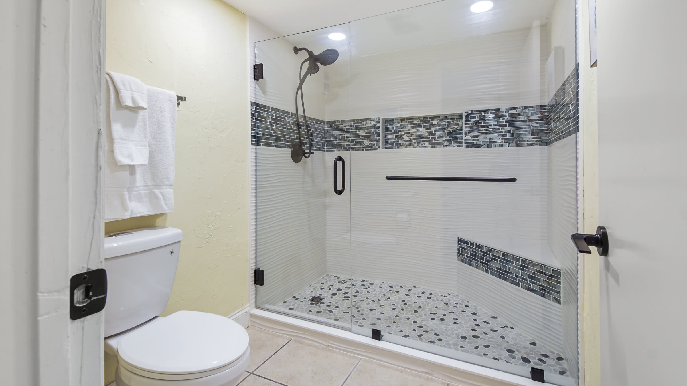 New master shower with bench.