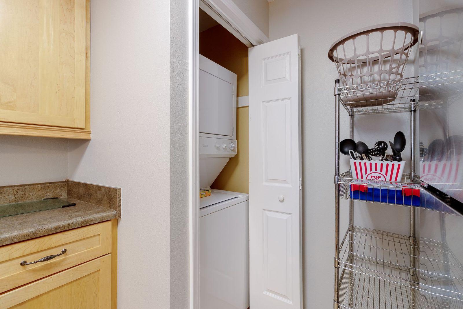 Laundry facilities and extra shelving.