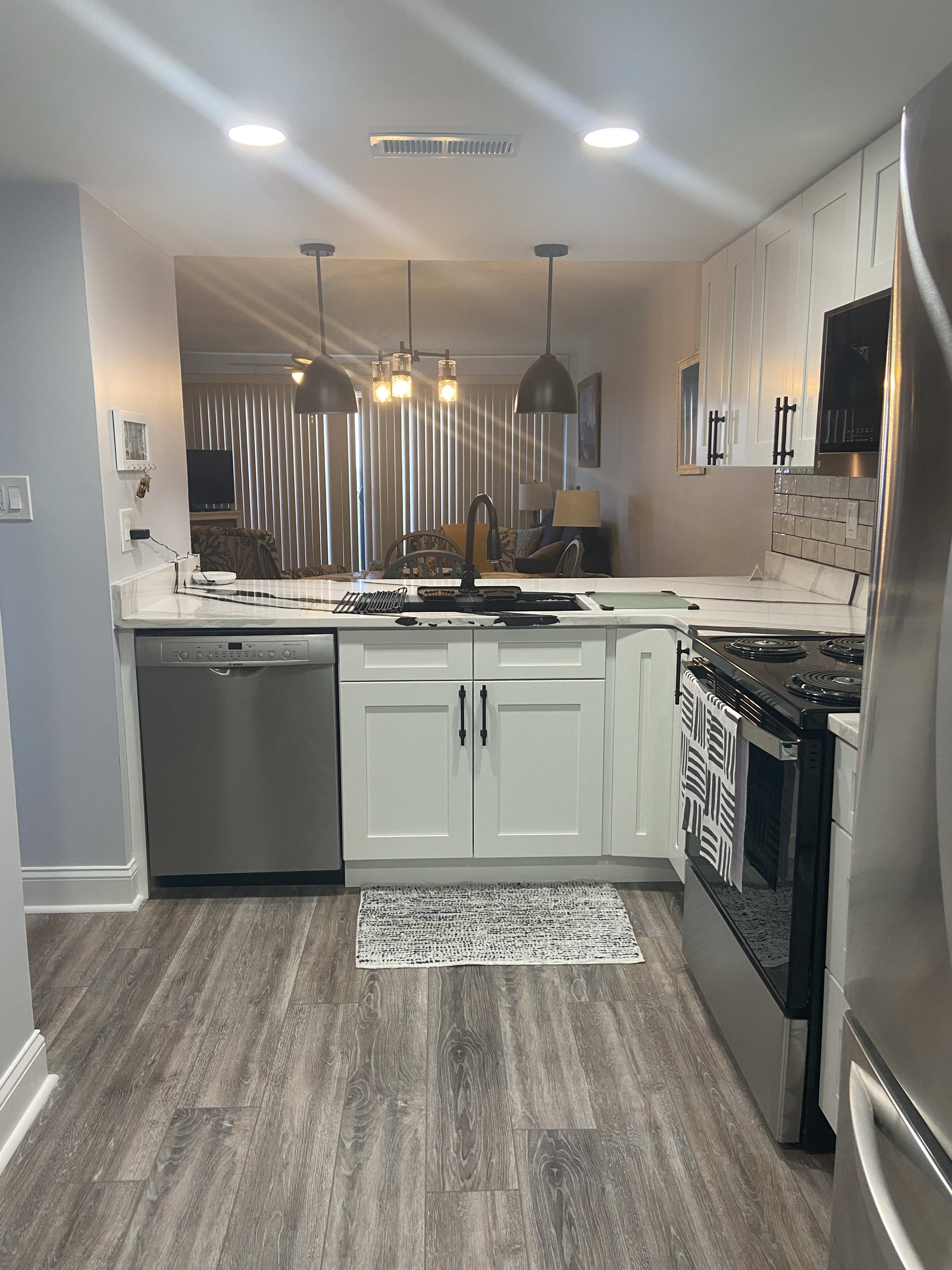 The remodel features quartz countertops, new stove and microwave.