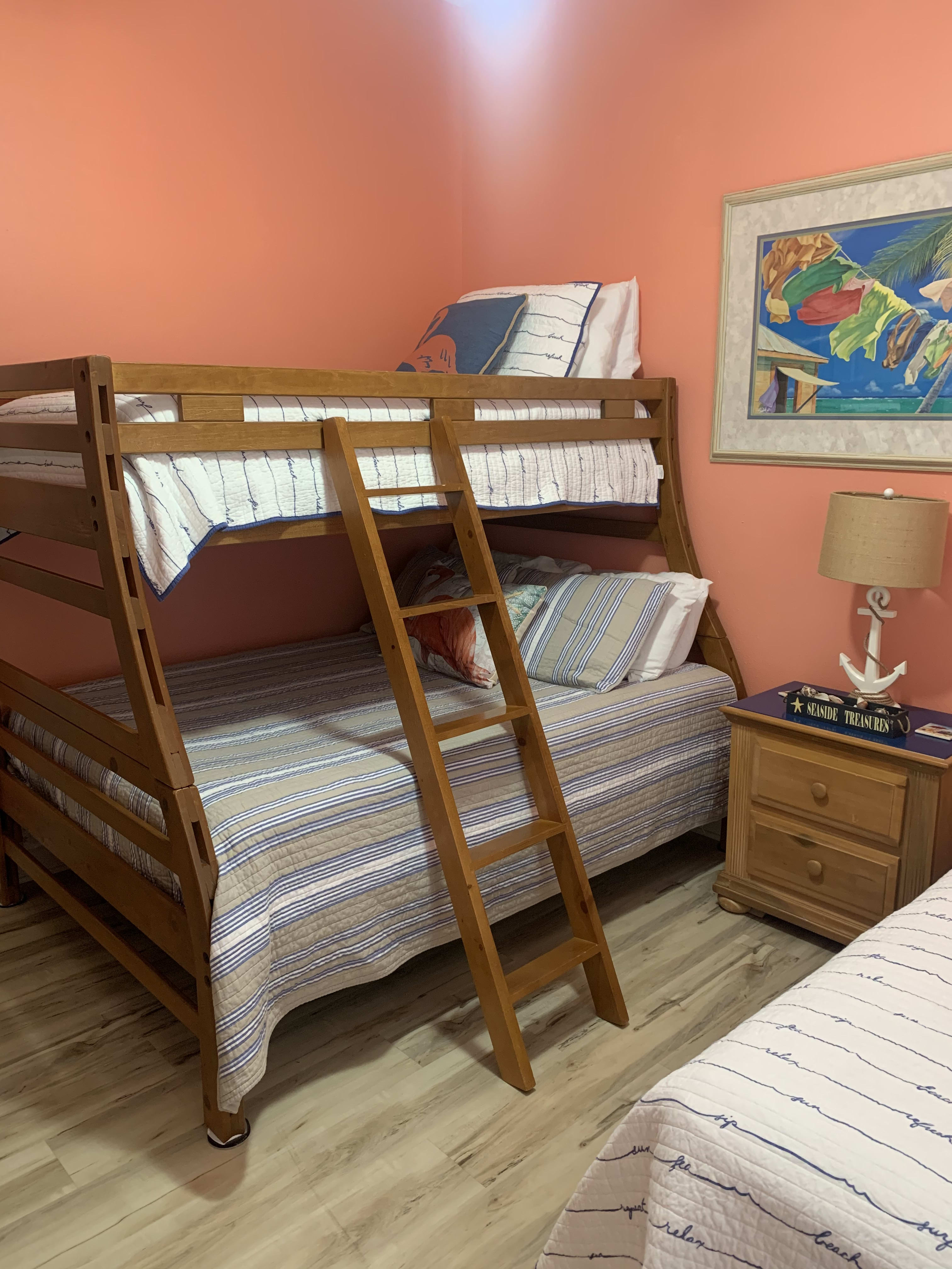 Guest bedroom with two twins and full size twin beds.