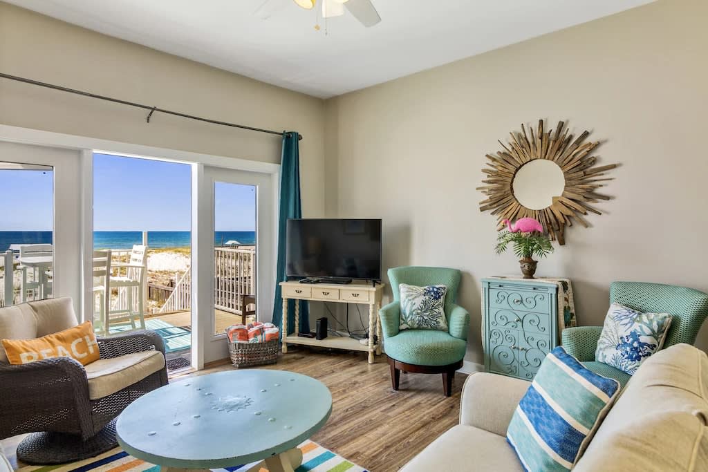 Main living area with beach views and HD TV, cable channels provided!!