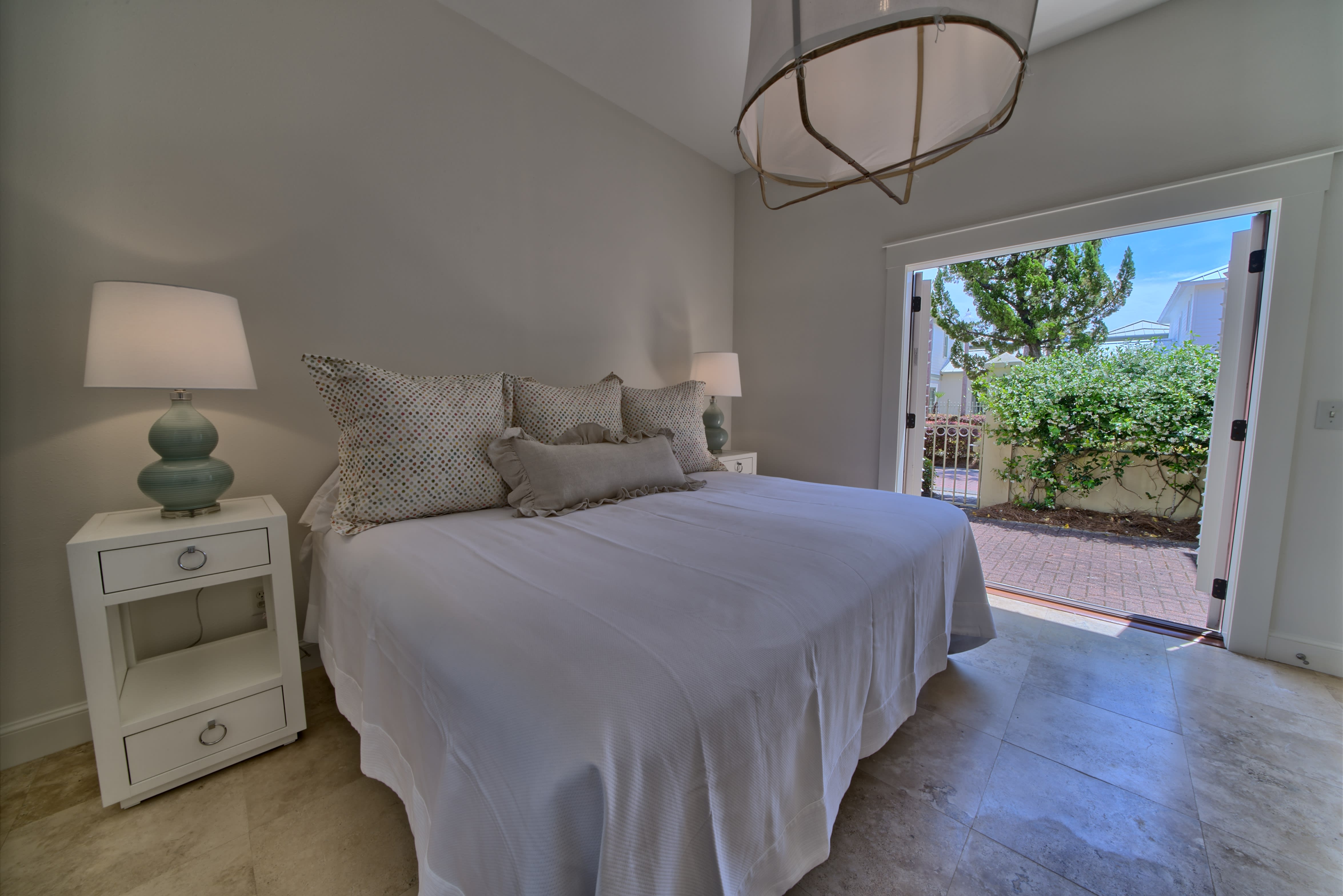 First Floor Master Bedroom with french doors to private courtyard.