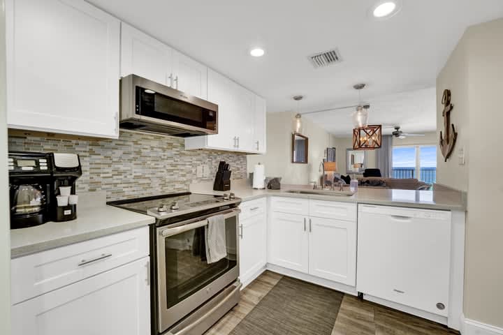 Full views of the living and dining areas from the kitchen.