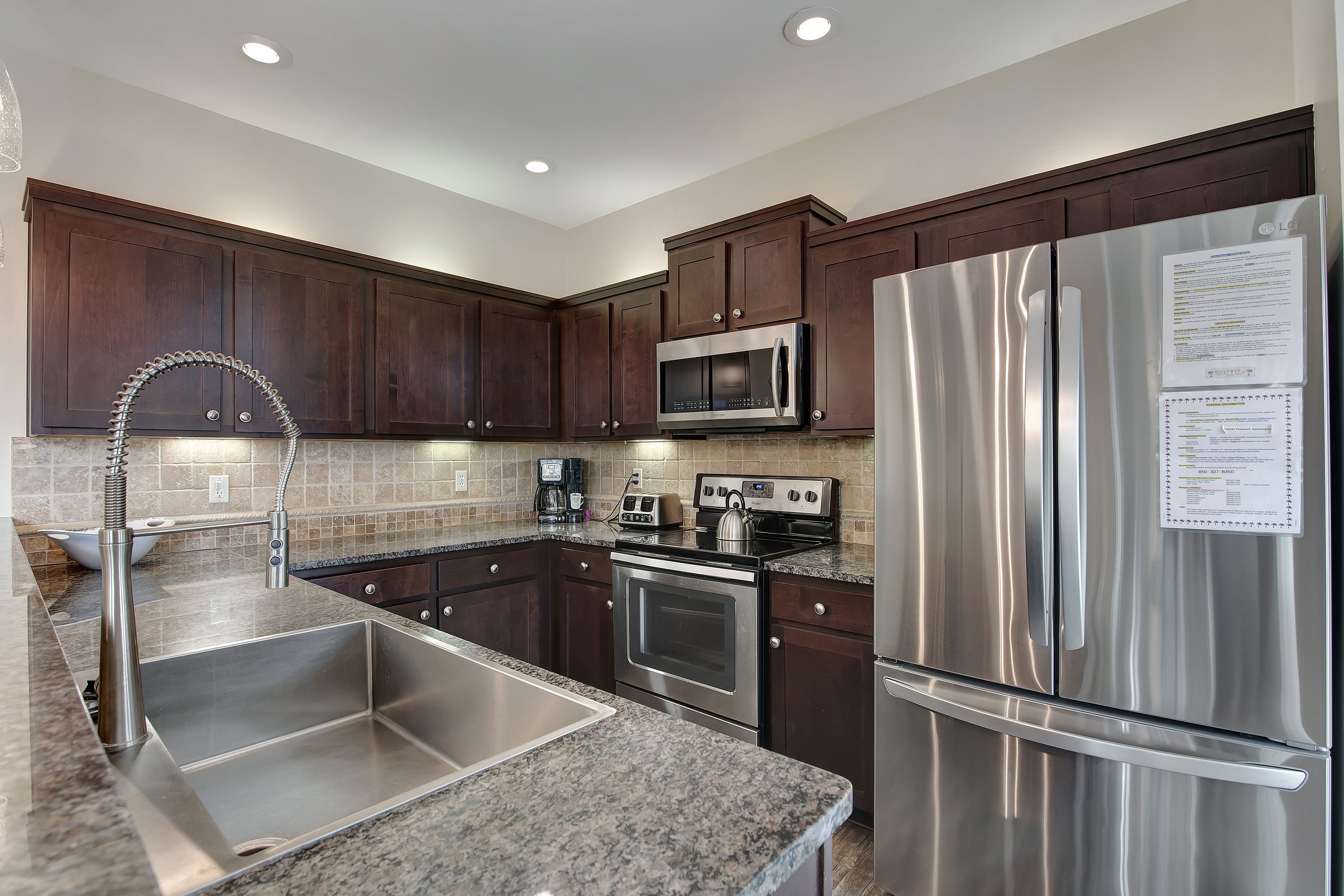 Kitchen with granite, stainless and eat-in breakfast bar