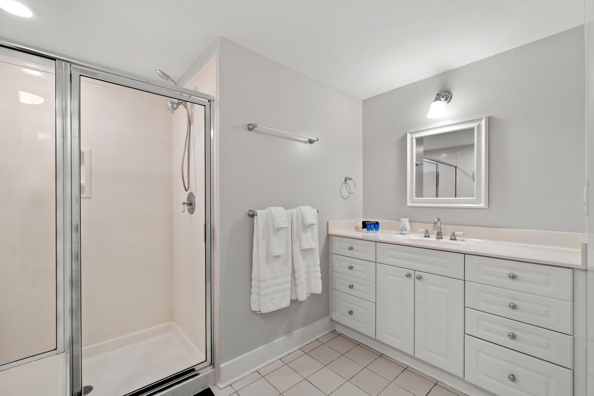 Queen Bathroom featuring tub and walk in shower 