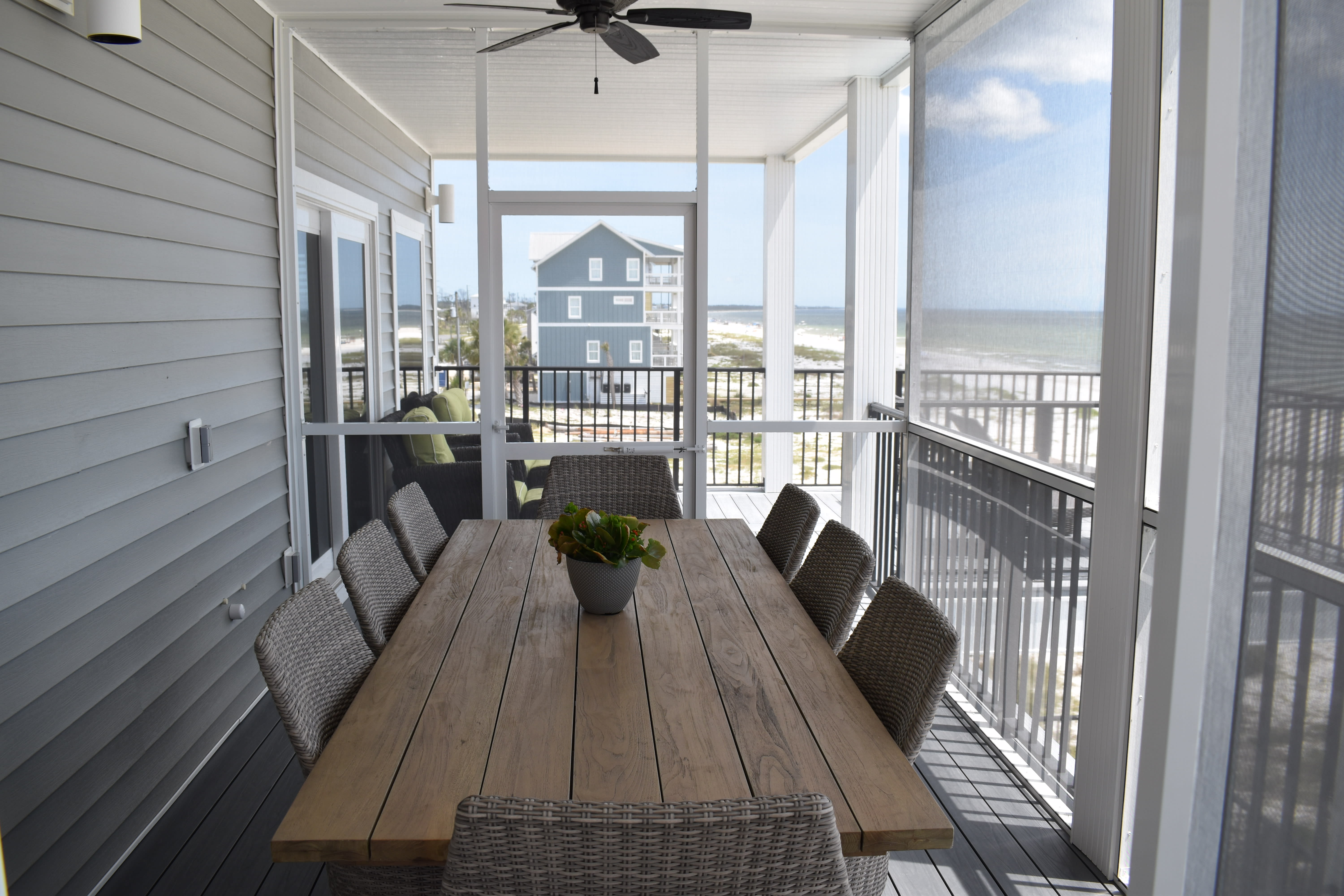 3RD FLOOR BALCONY SCREENED AREA WITH TEAK DINING TABLE SET &amp; 2 CEILING FANS
