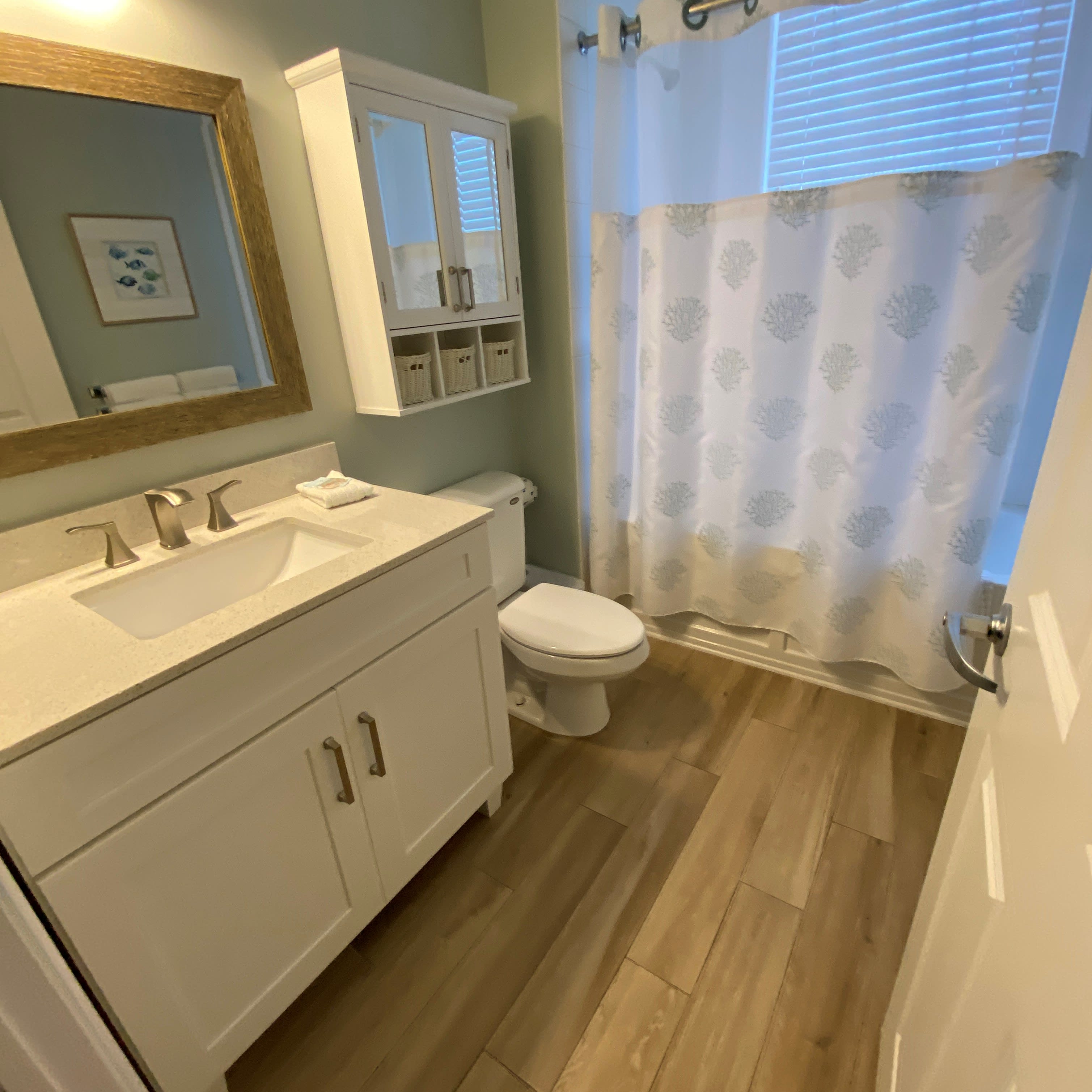 Bathroom 3-  Plenty of storage, tub/shower has window with gulf views.