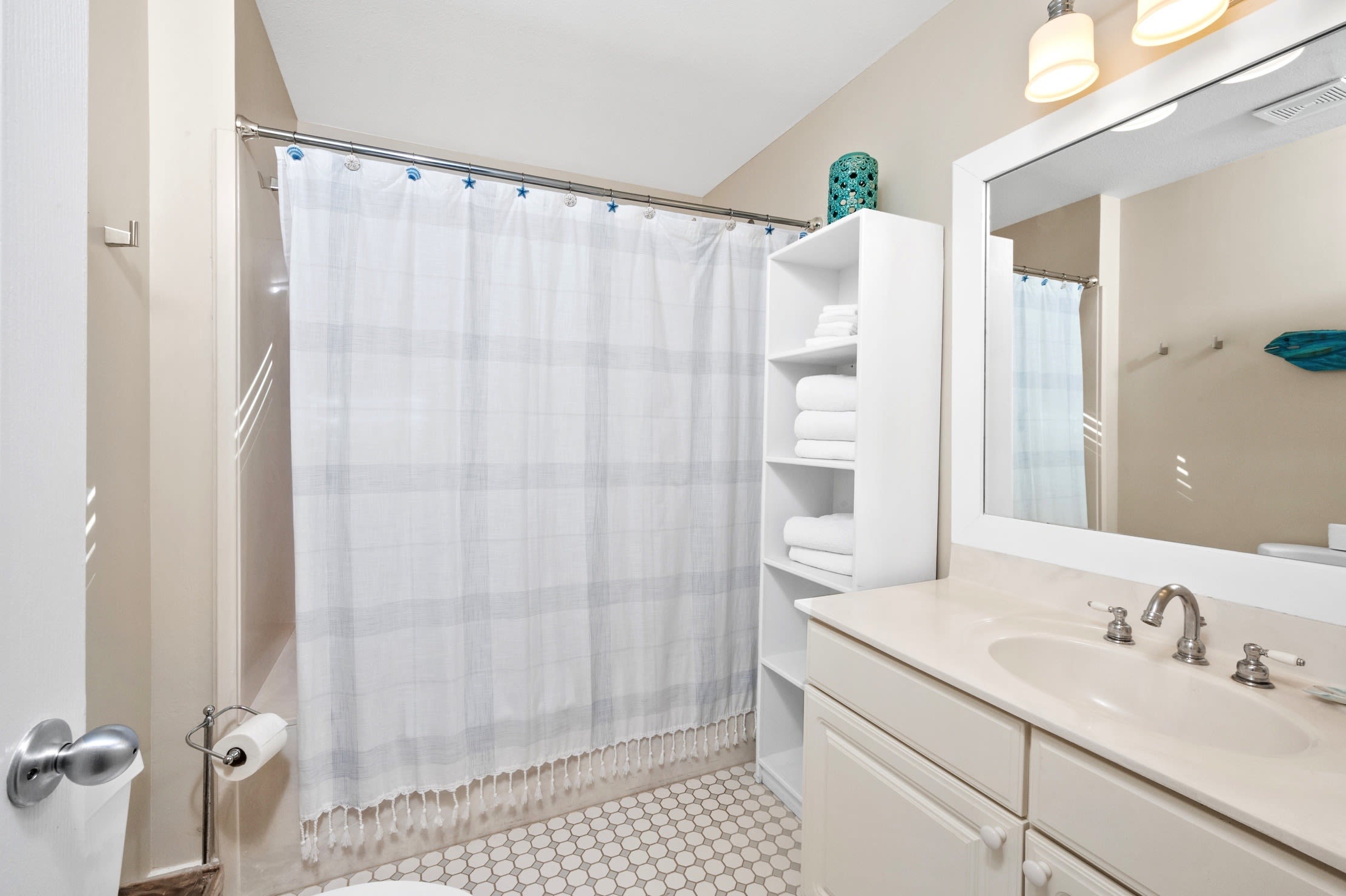 Upstairs bath with full tub/shower combination.