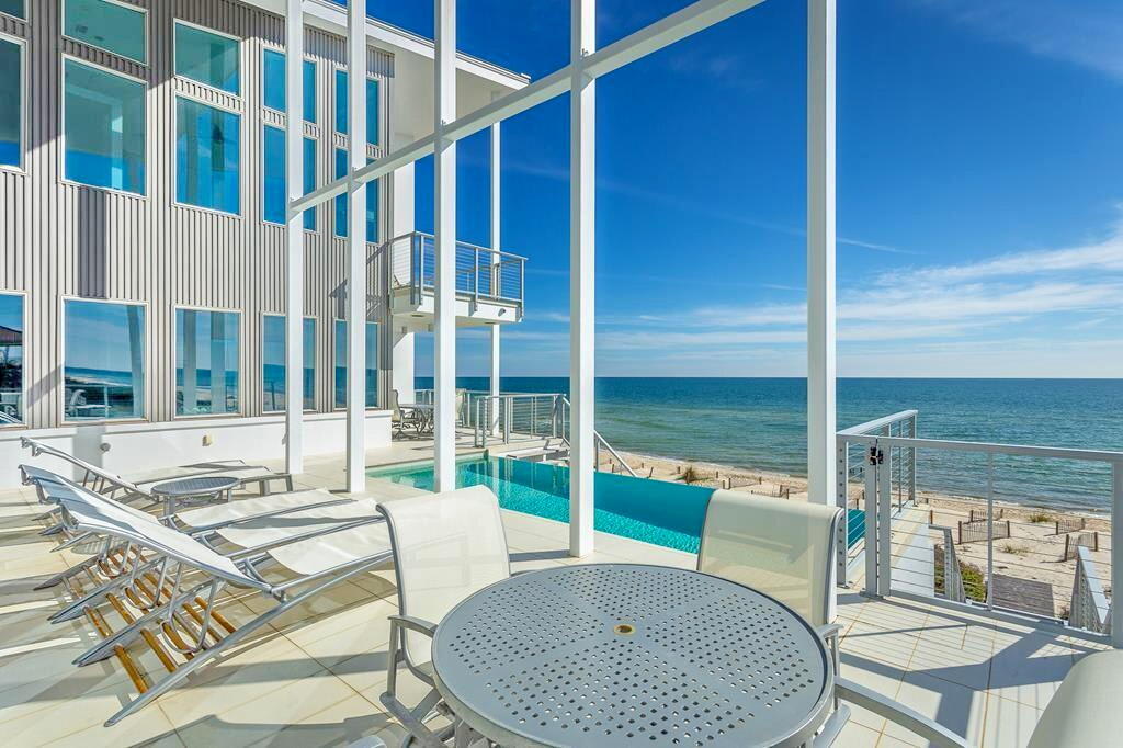 This luxurious pool deck has room and seating for your entire group