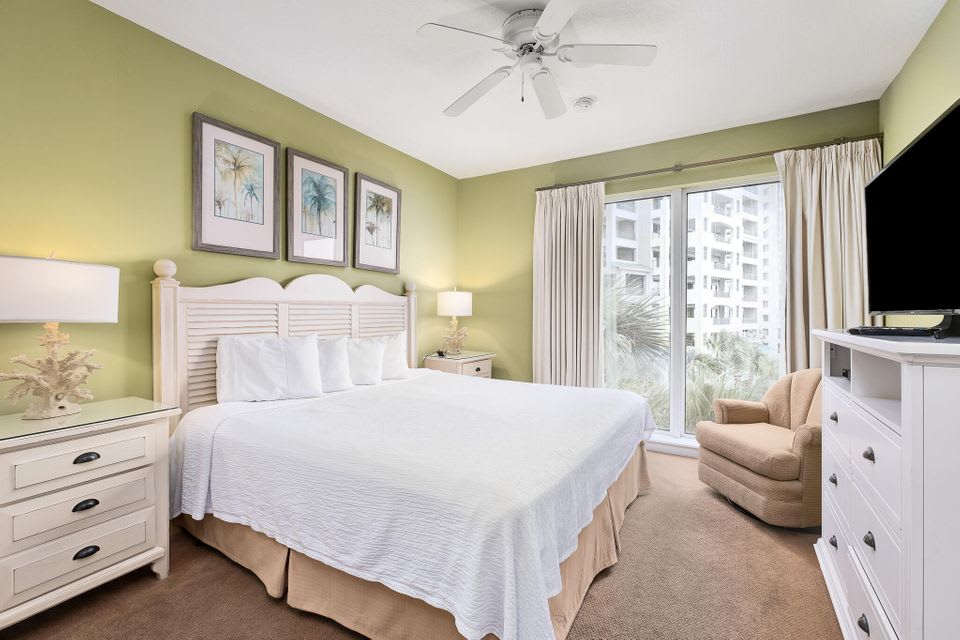 Guest King bedroom with floor to ceiling windows and gulf view