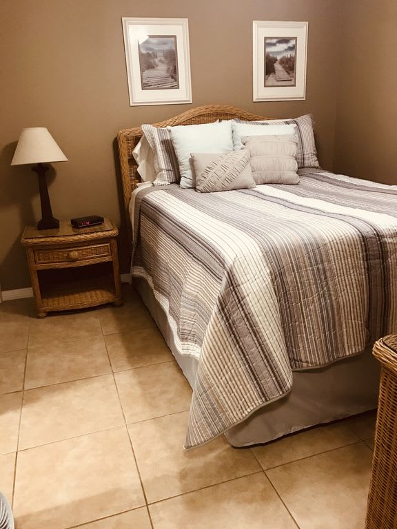 Queen bedroom with flat screen television