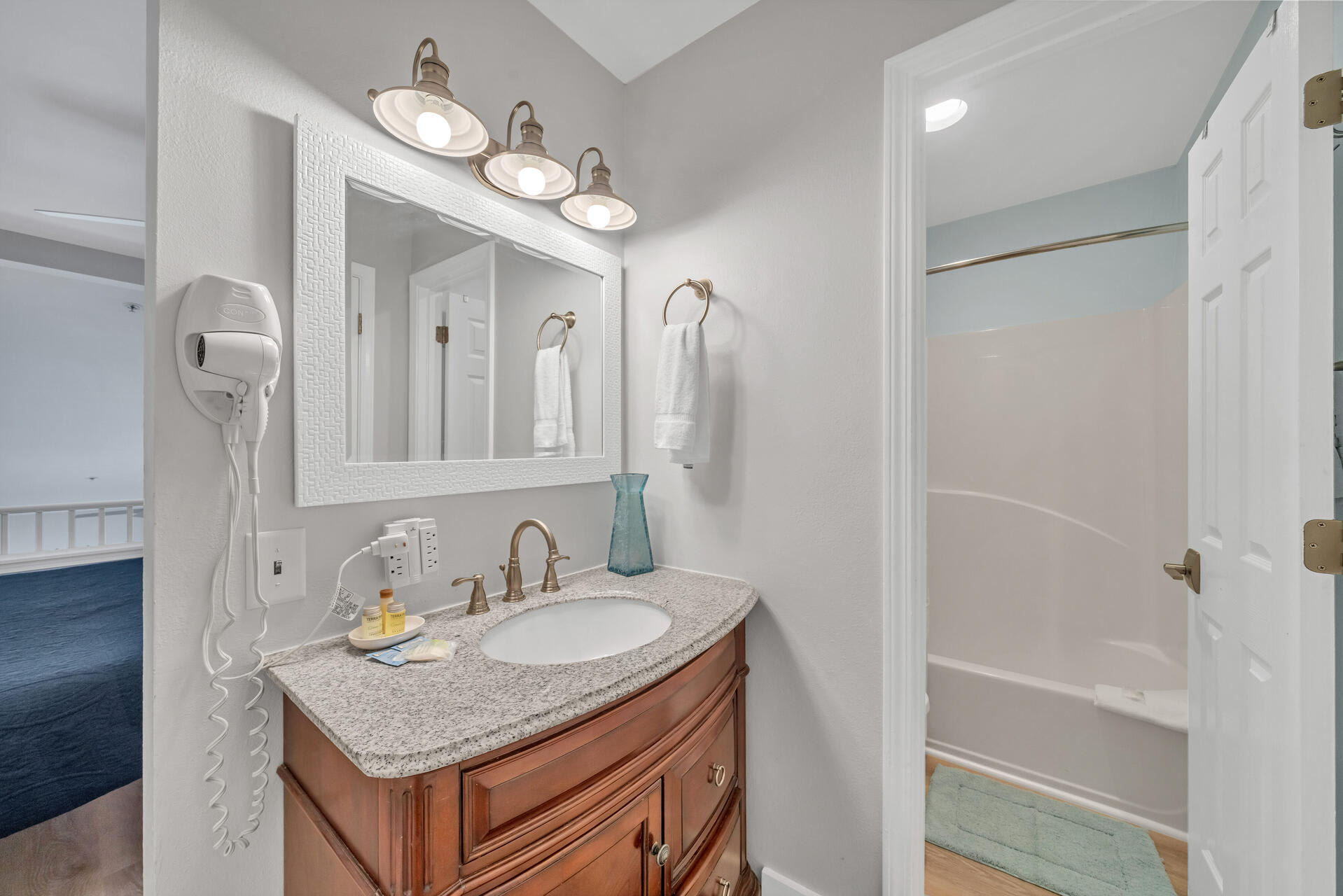 Loft bedroom with tub and shower