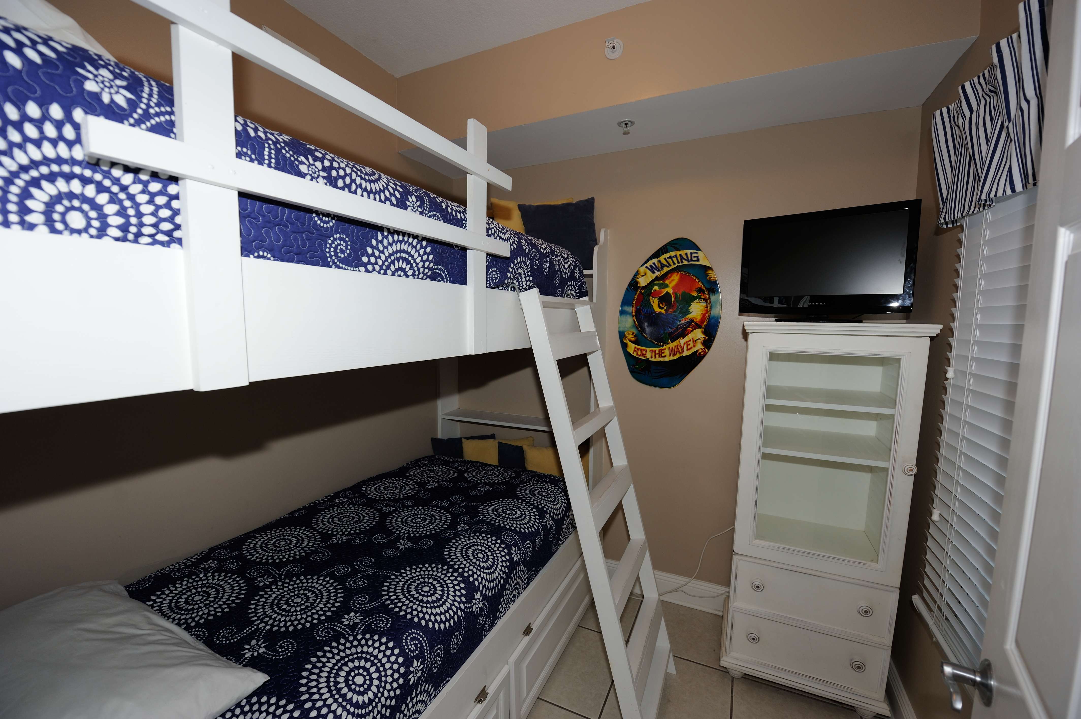 Third bedroom with built-in bunk beds and TV for the kids