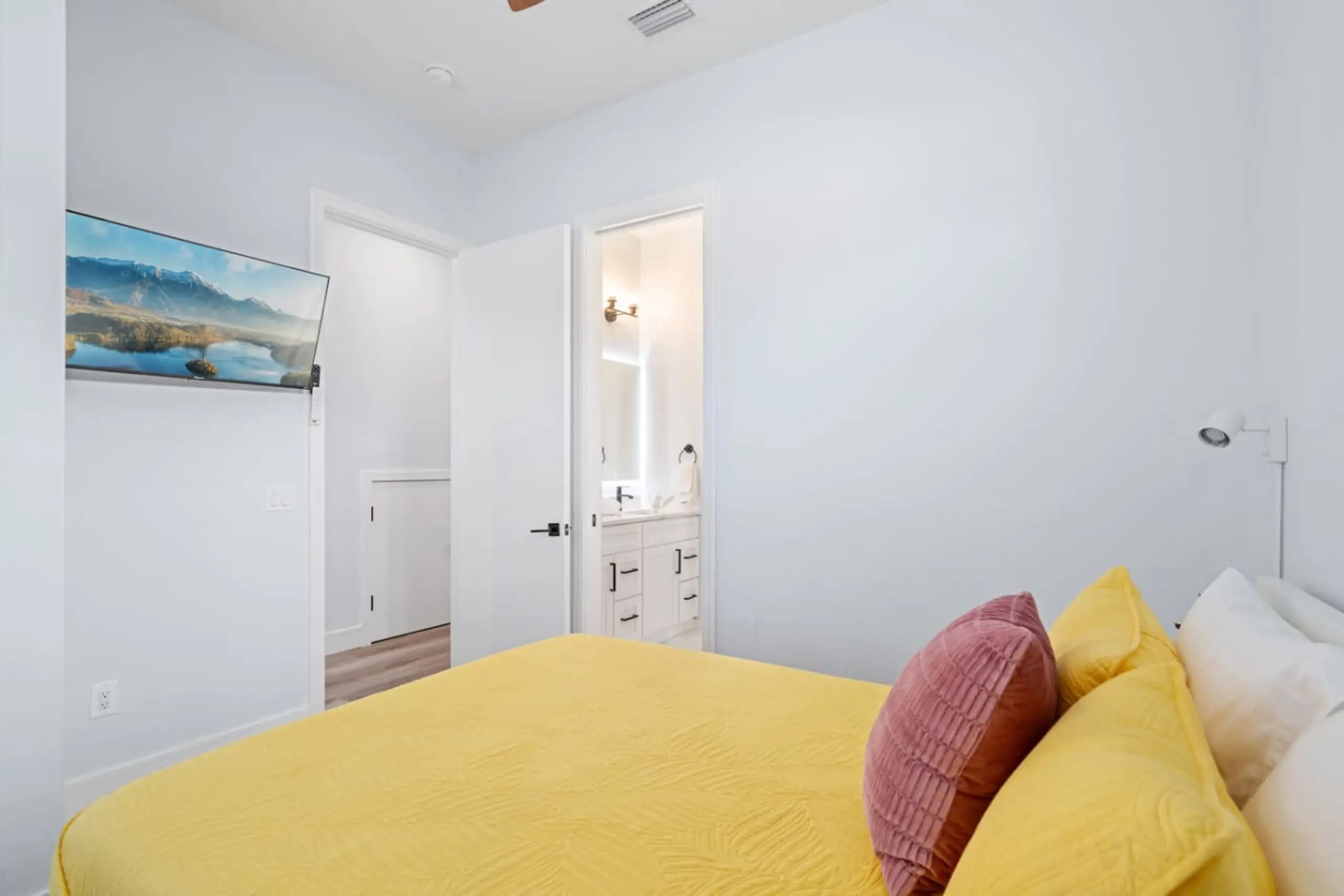 Second Queen bedroom downstairs with jack and jill bathroom and large smart TV