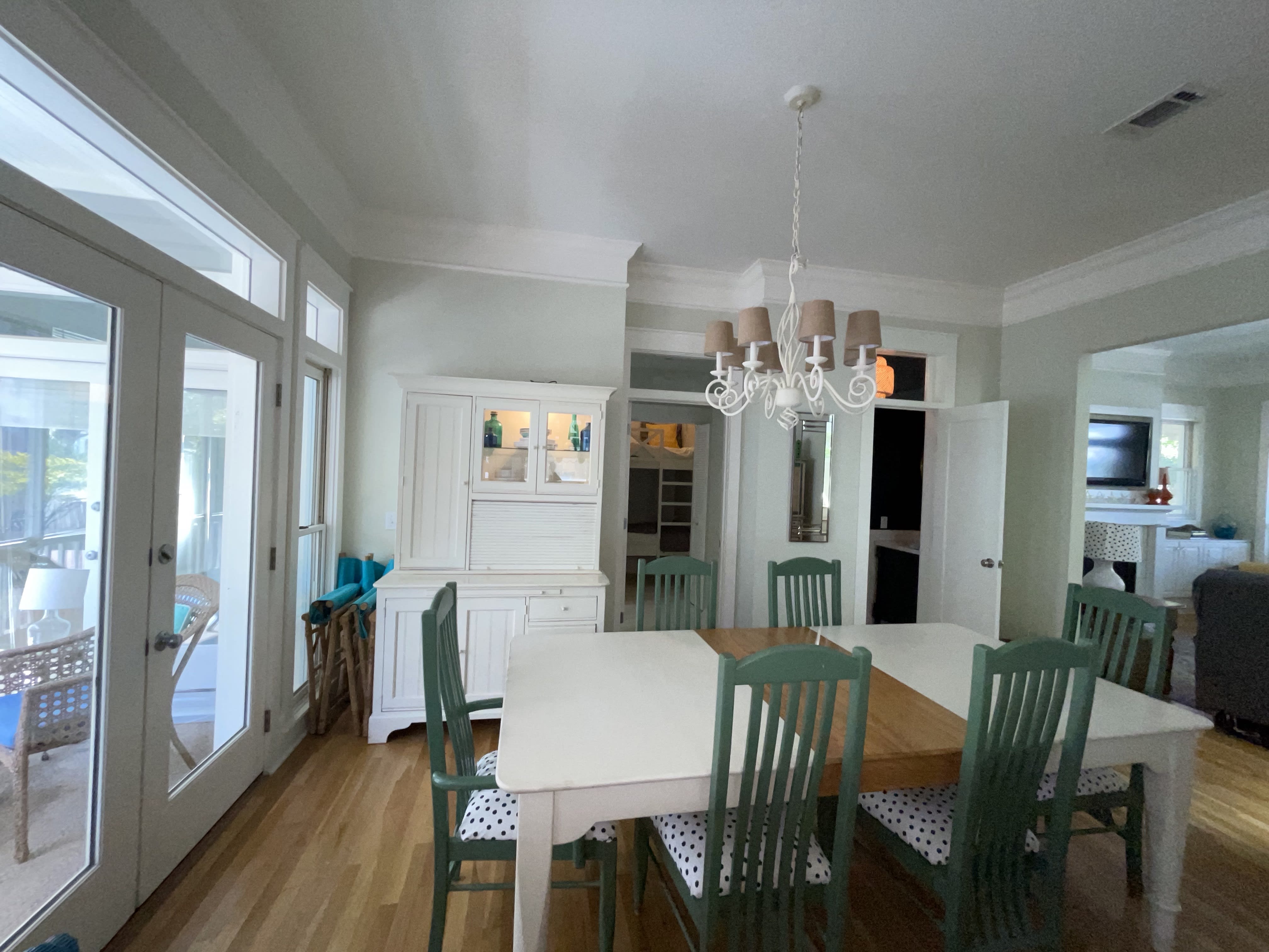 Open concept main living area with views of the front and back porches