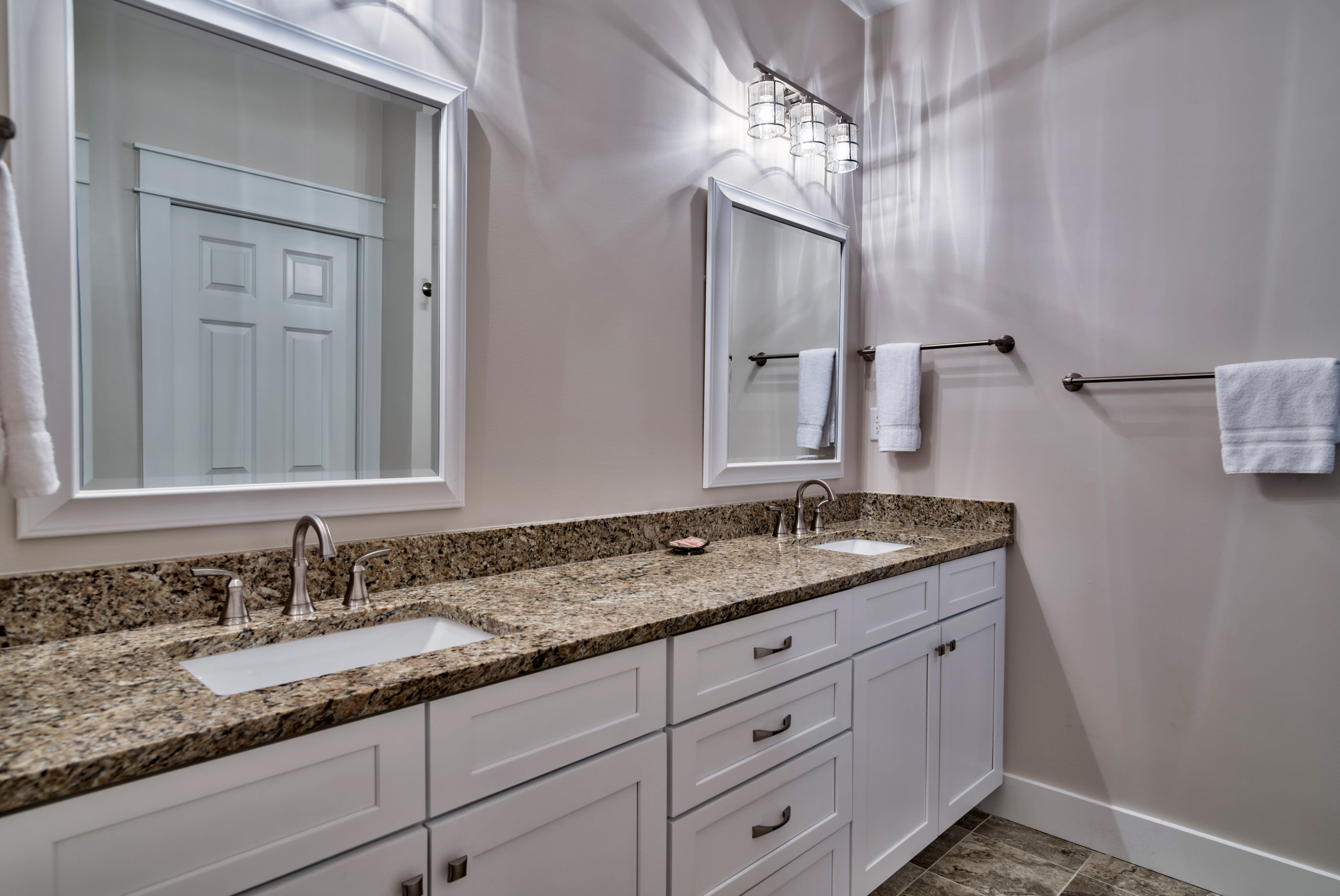 2nd Floor Master Suite Bathroom with double vanities and a walk-in shower