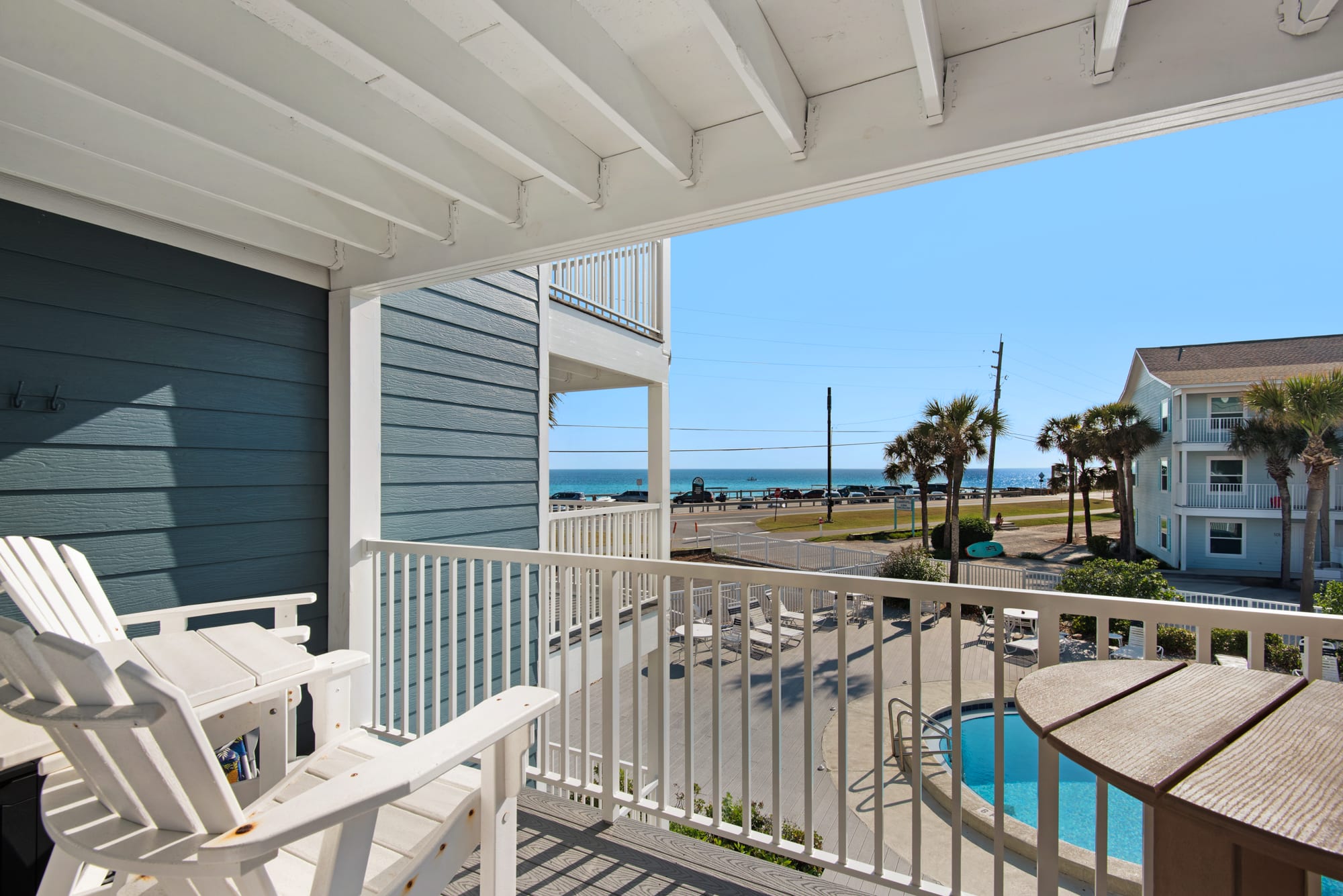 Balcony with Adirondack tall chairs and table