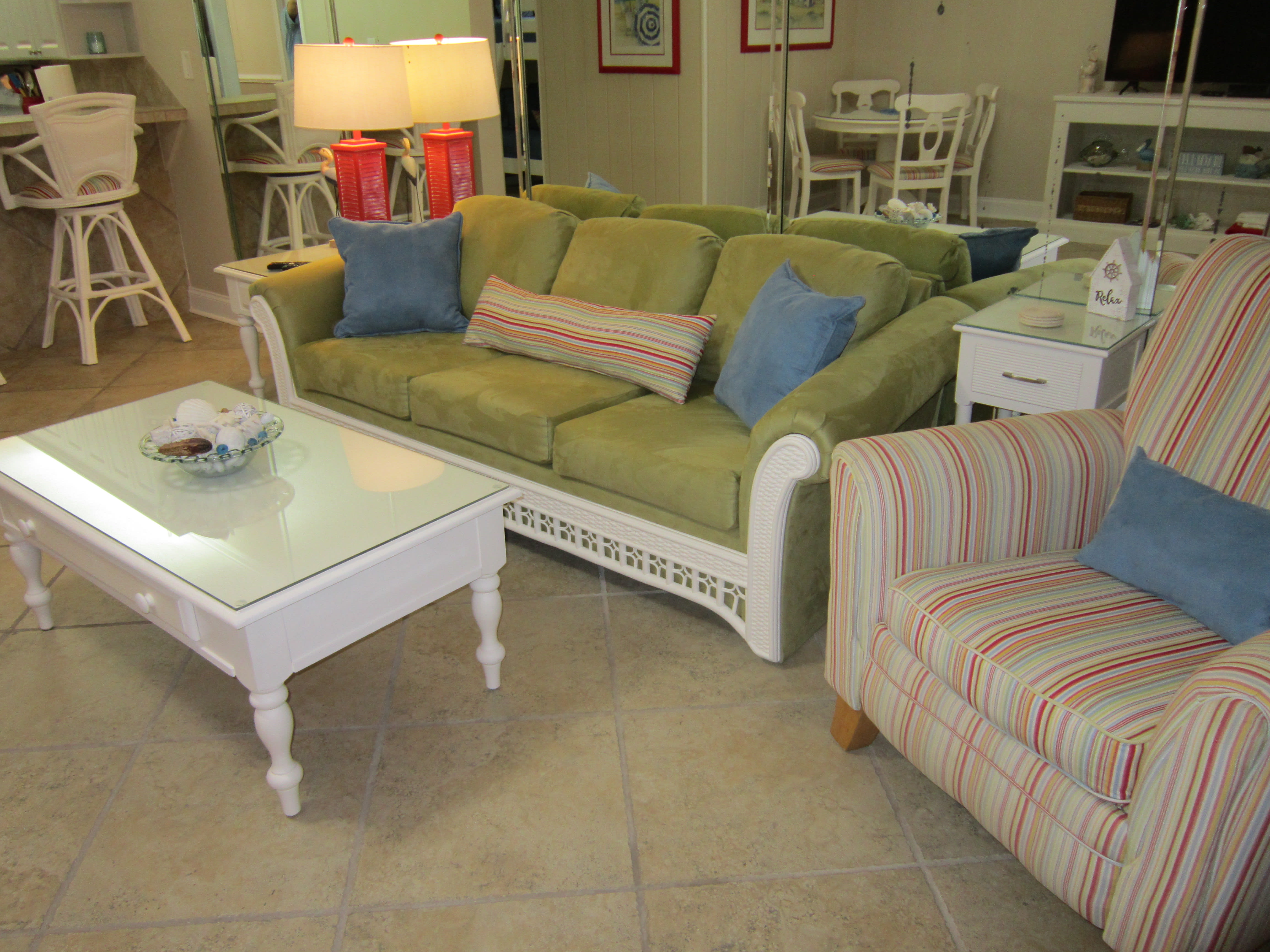 Living room with queen sleeper sofa and two recliners.