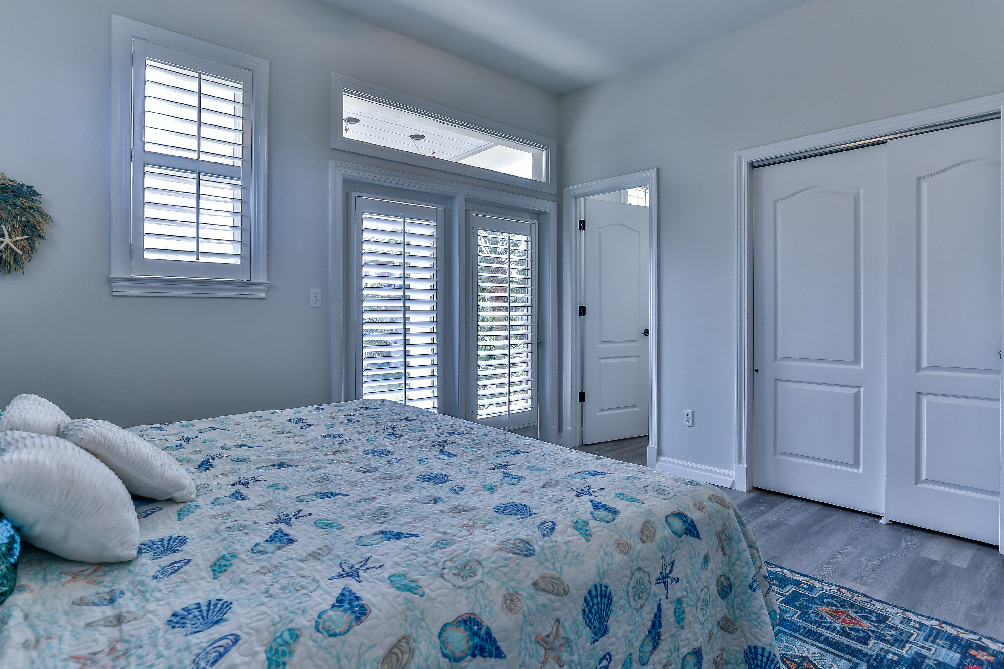 Main floor bedroom, king bed, balcony with view of gulf