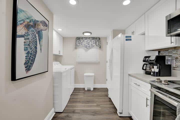 Galley style kitchen with lots of lighting.