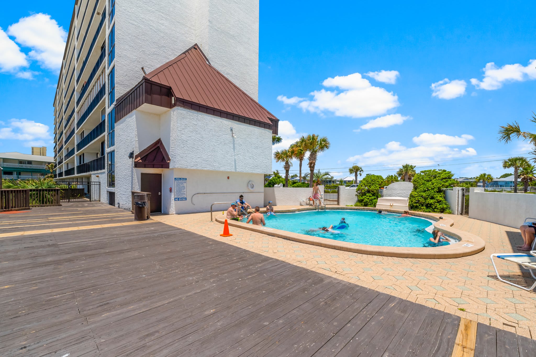 POOL LOCATED BETWEEN BUILDING IN BREEZWAY WITH OCEAN VIEWS