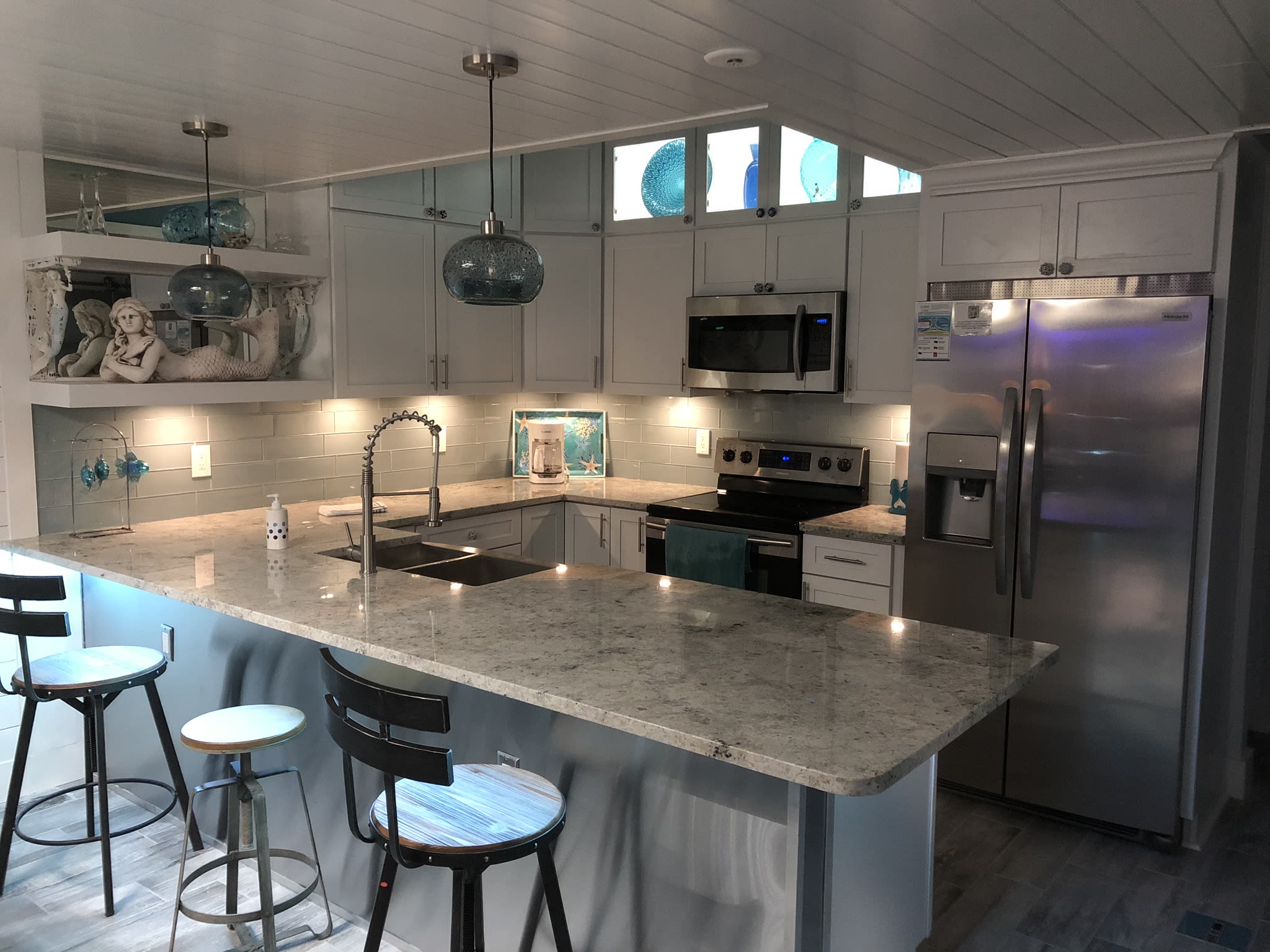 Modern coastal kitchen with state-of-the-art amenities &amp; LED lighting 