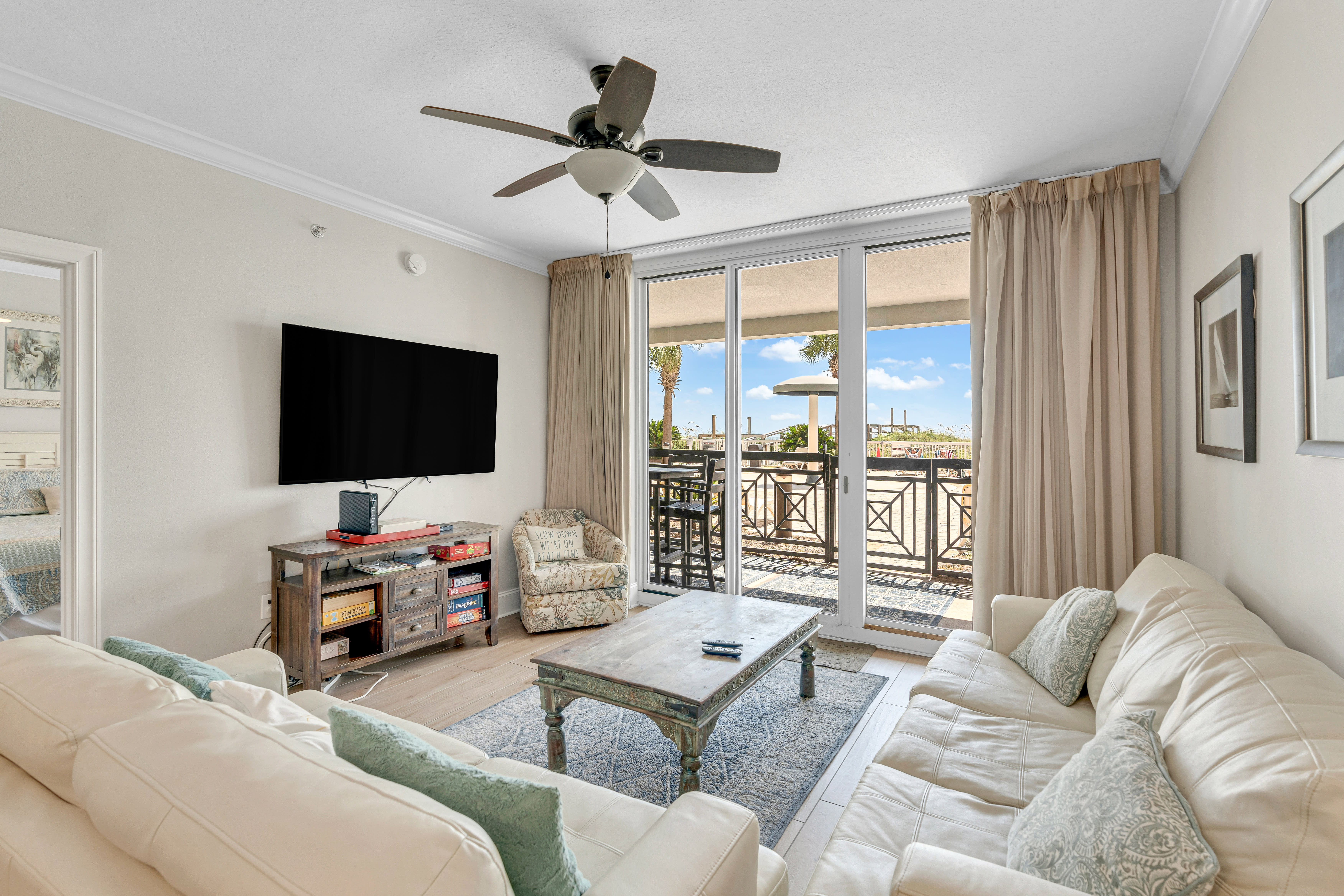 Spacious living area with natural light and direct patio access