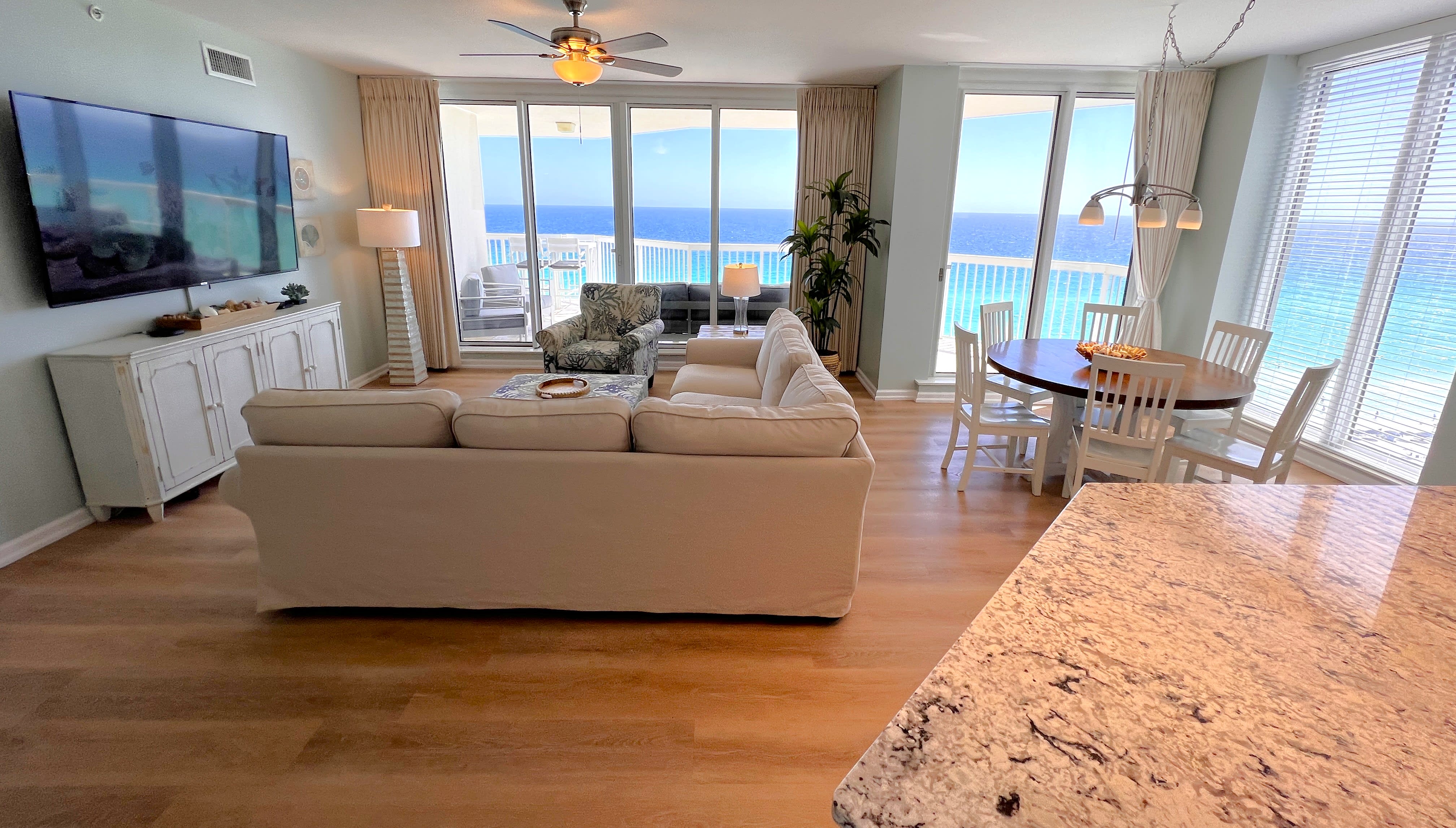 Living, dining and kitchen area filled with floor to ceiling ocean views!