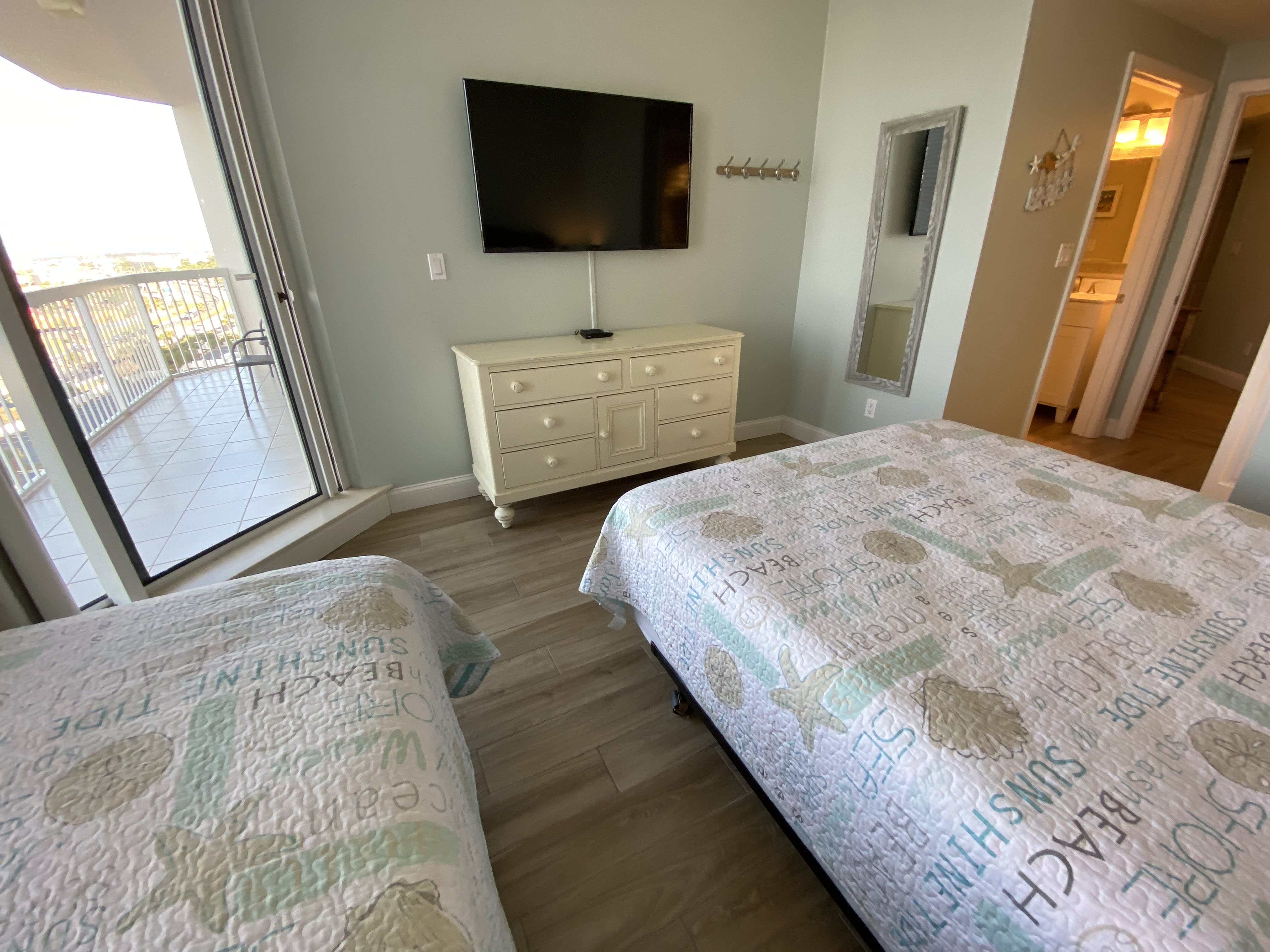 Bedroom 3- Features a private full bath, balcony access and 50 inch HD Tv.