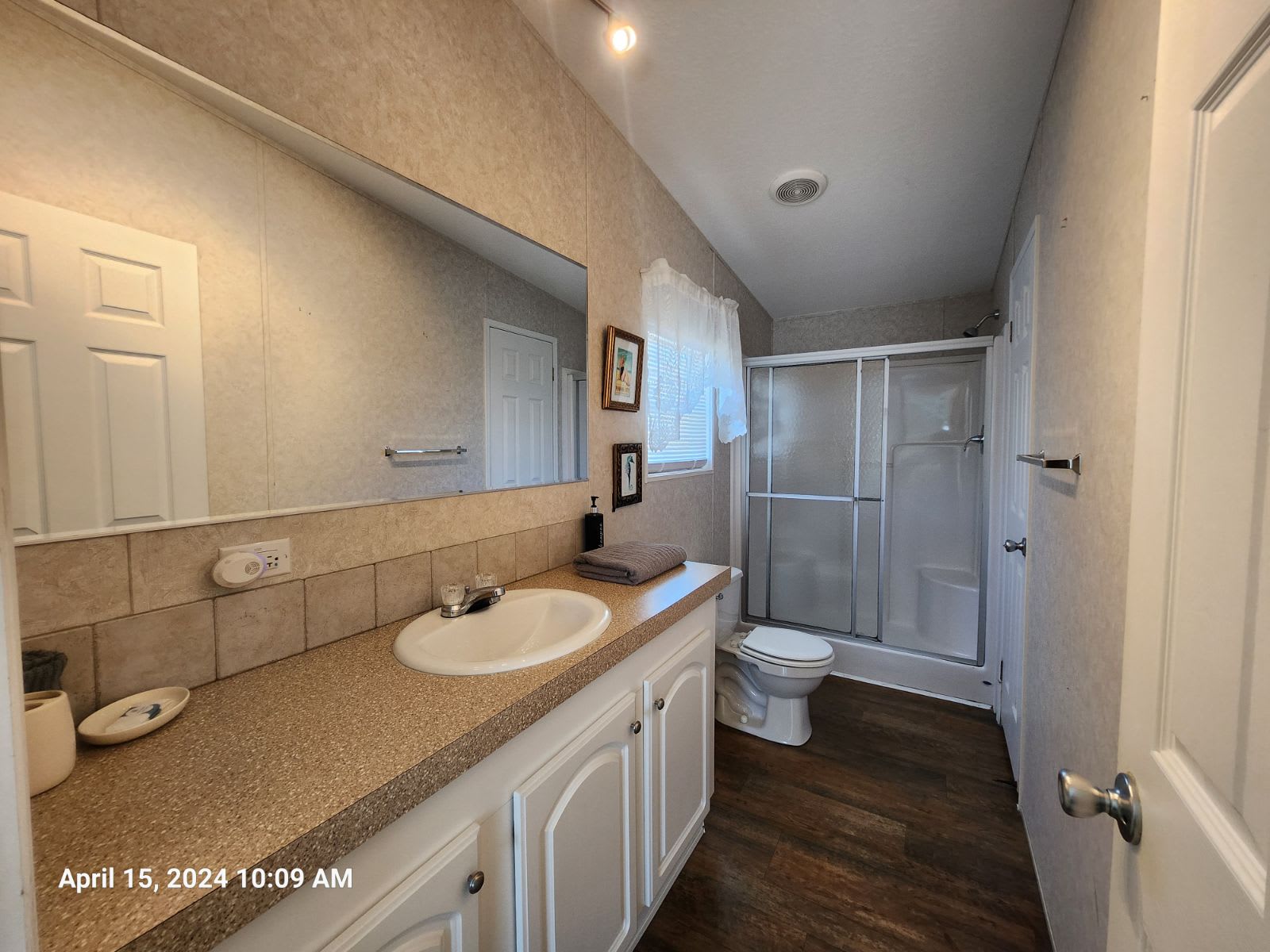 Master Bath with walk-in shower, sink, and toilet. Attached to the Master bedroom