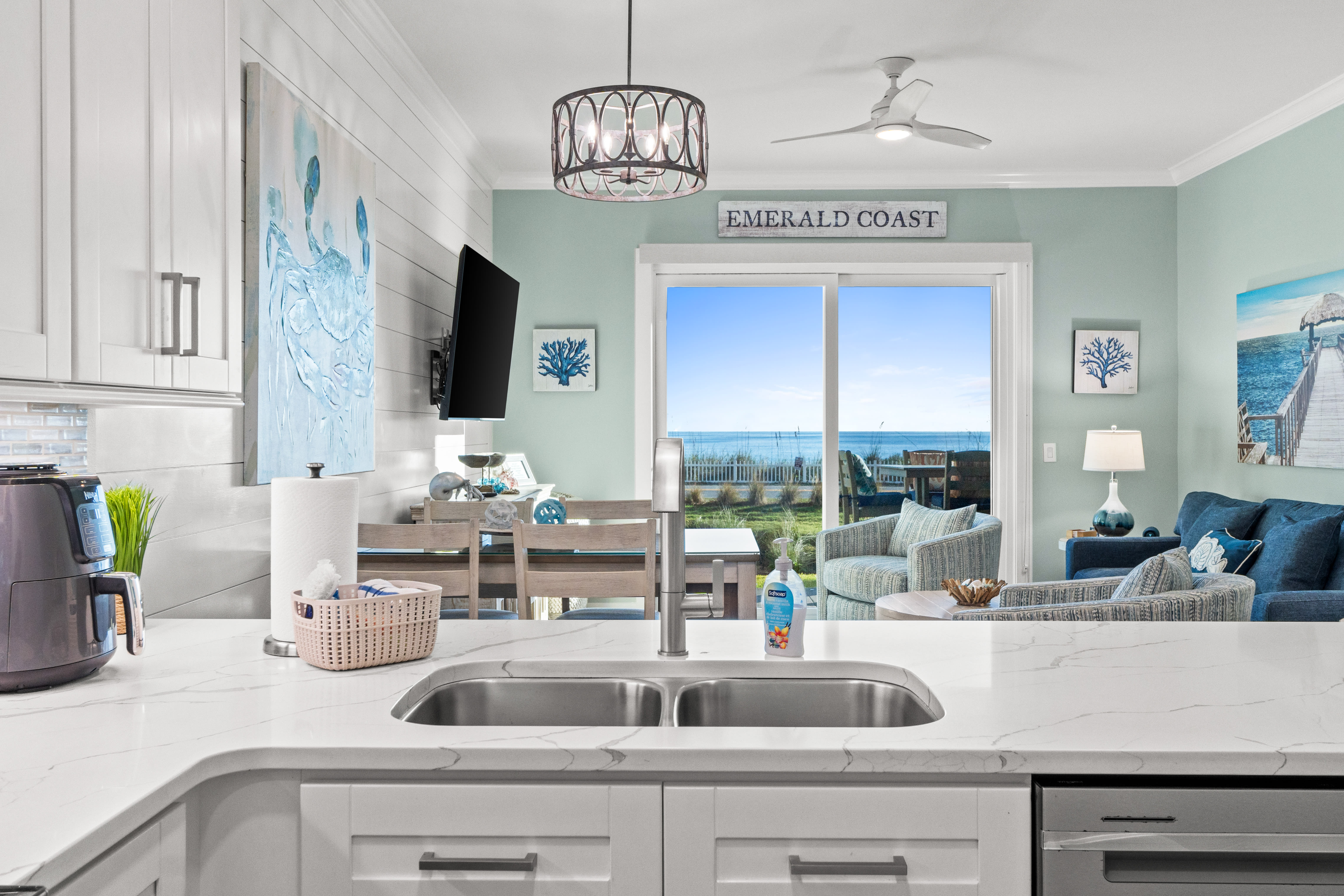 Modern Kitchen flows to living room with stunning Gulf Views 