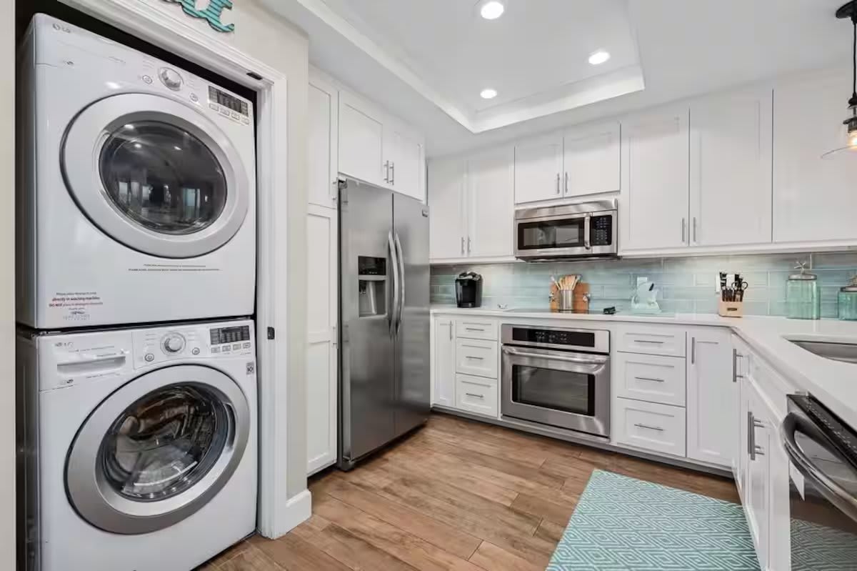 Top-of-the-line stainless steel appliances, custom cabinetry, crisp quartz countertops