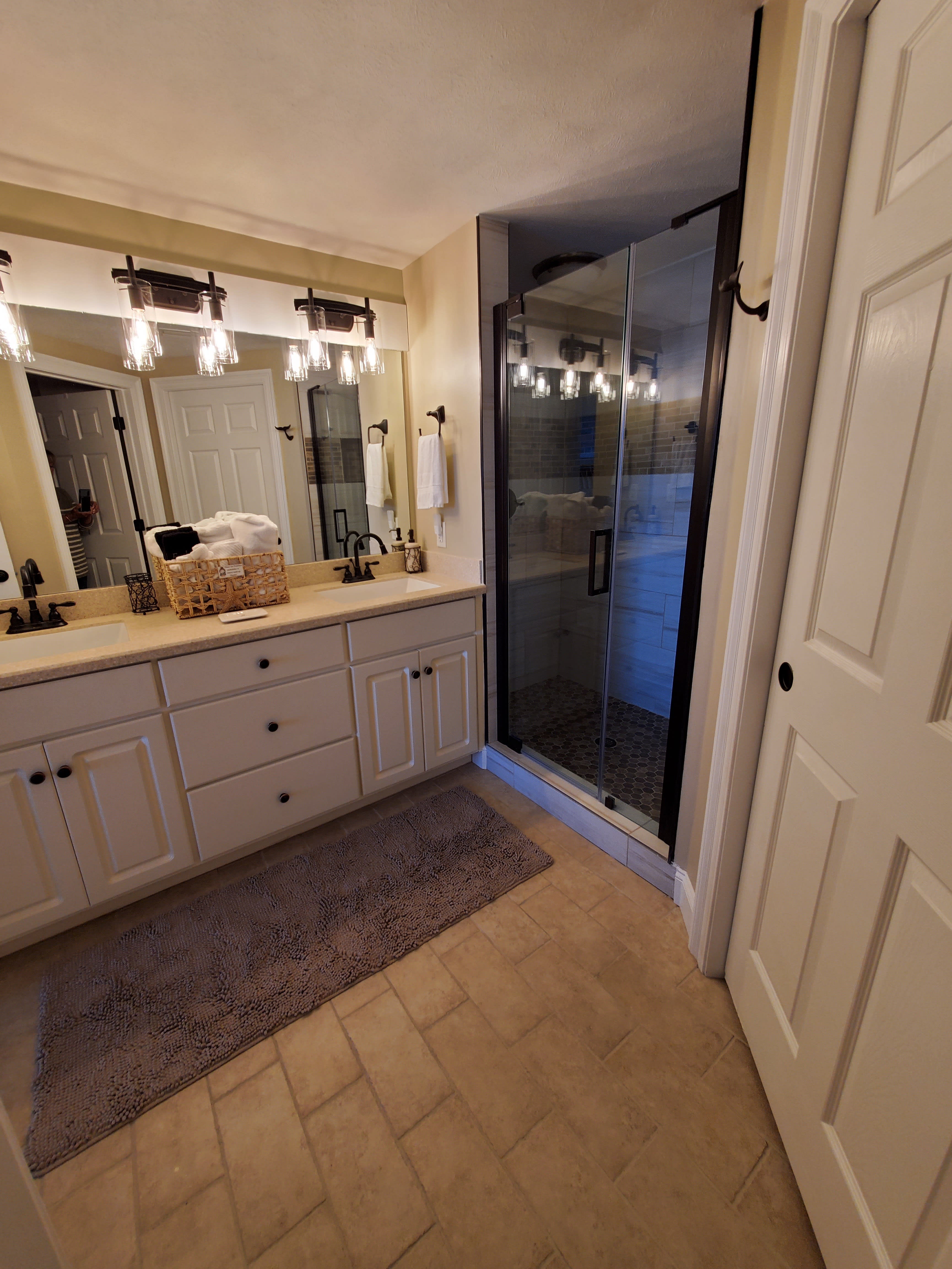 Master bath has double sinks,dual headed shower,separate toilet, &amp; large closet.