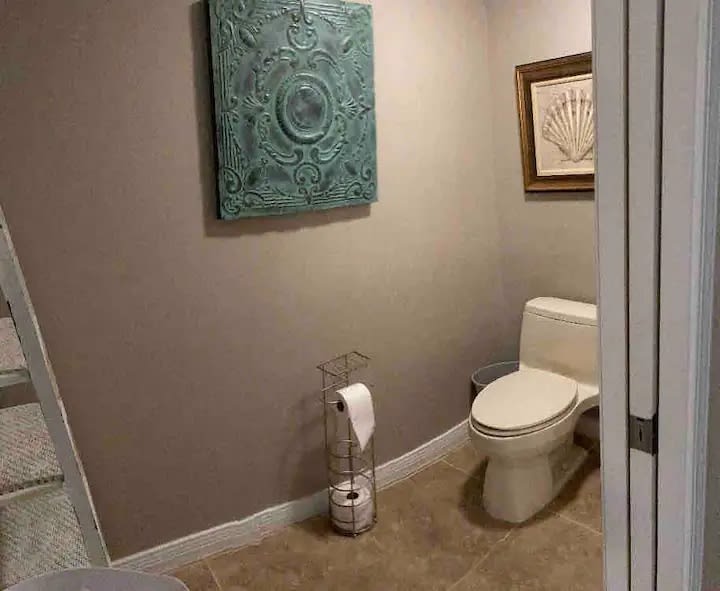 Here is the attached toilet room located in the master bathroom.