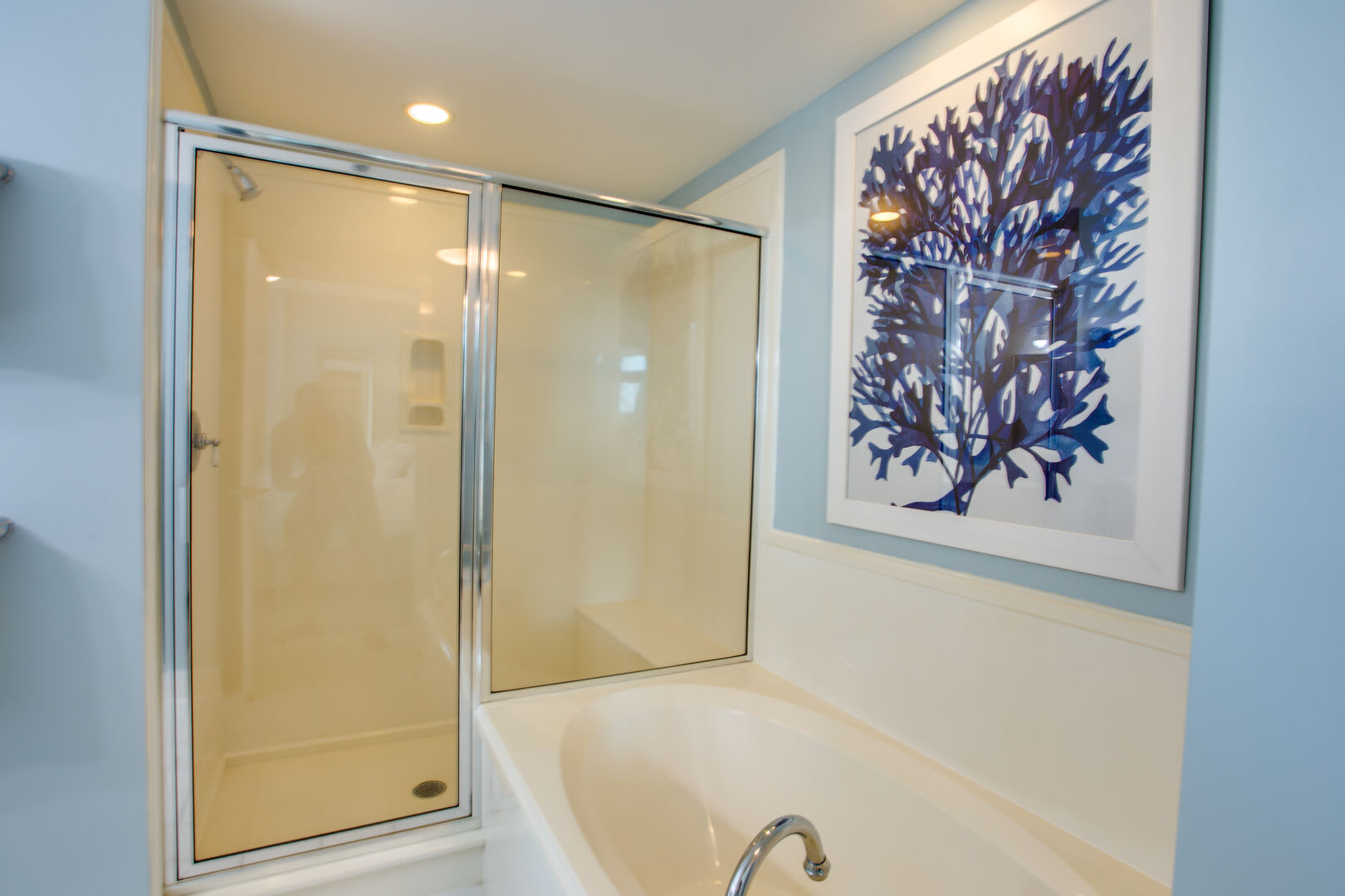 Both full bathrooms have a large walk-in shower and garden tub.