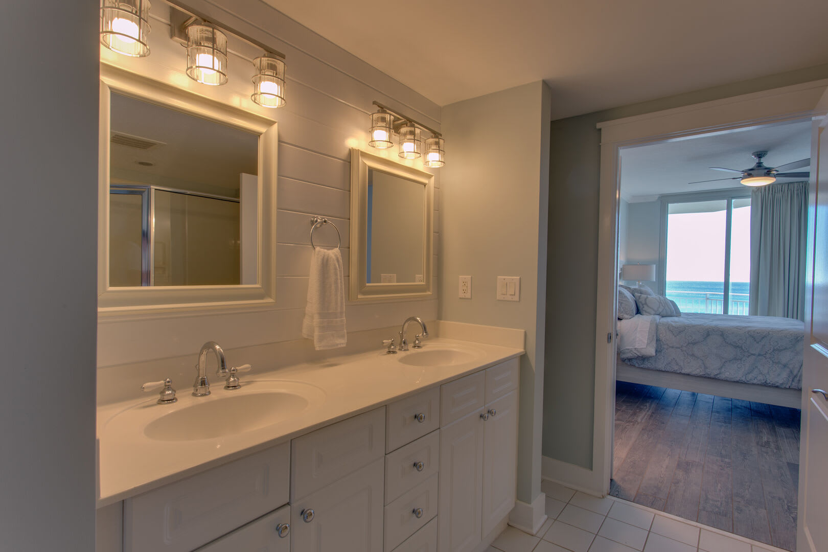 Catch the sunset from the master bathroom while getting ready to head out for dinner after a day on the beach.