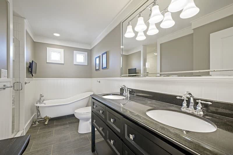 Master Bathroom with clawfoot tub and TV