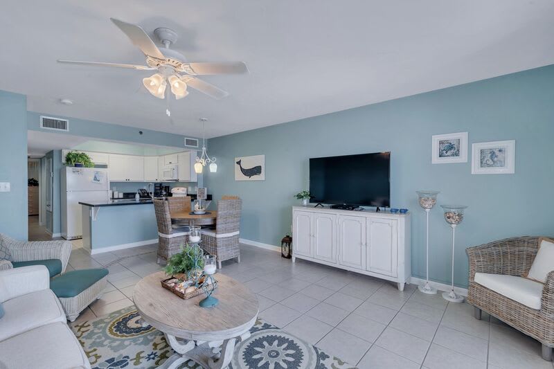 Spacious Living Area with Full Size Sleeper Sofa and Cozy Dining Table for 4