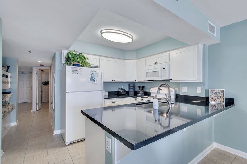 Beautifully Updated Kitchen with Granite Countertops and views of the Gulf